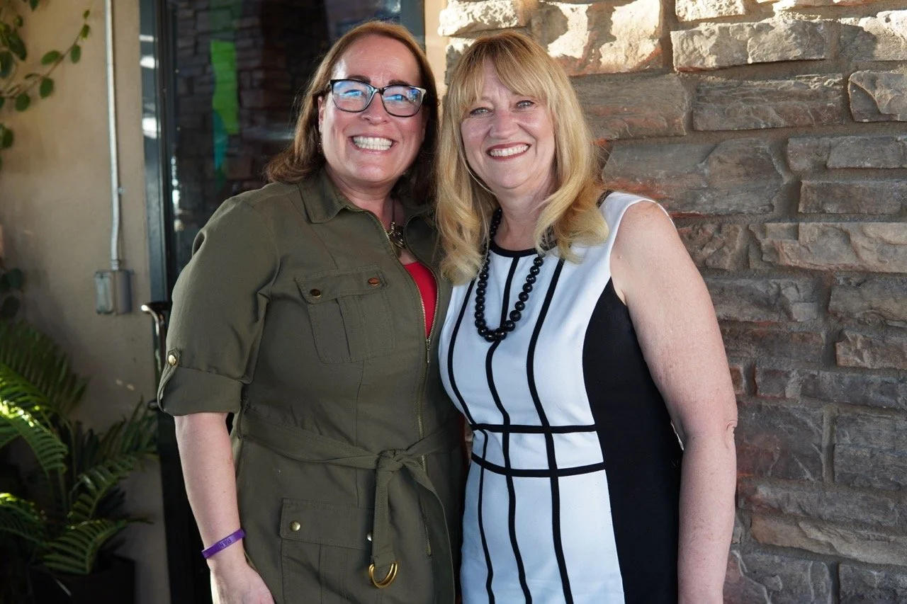 Kimberly MacKinney, Executive director, Secondary Schools Fontana Unified School District posing with Cali.