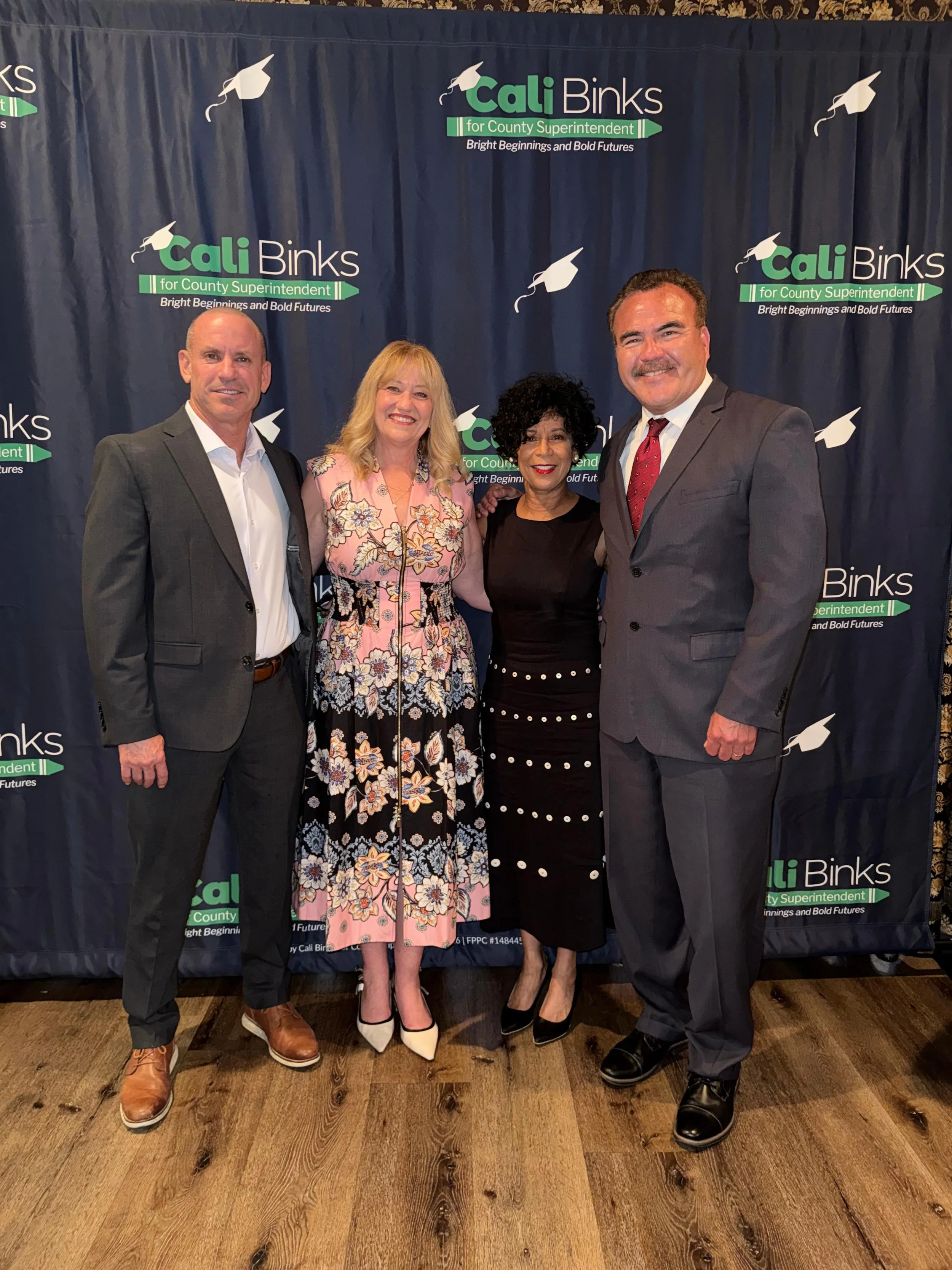 Mat Holton, Cali Binks, Dr. Lynne Kennedy, and Ted Alejandre posing for a photo at the fundraiser.