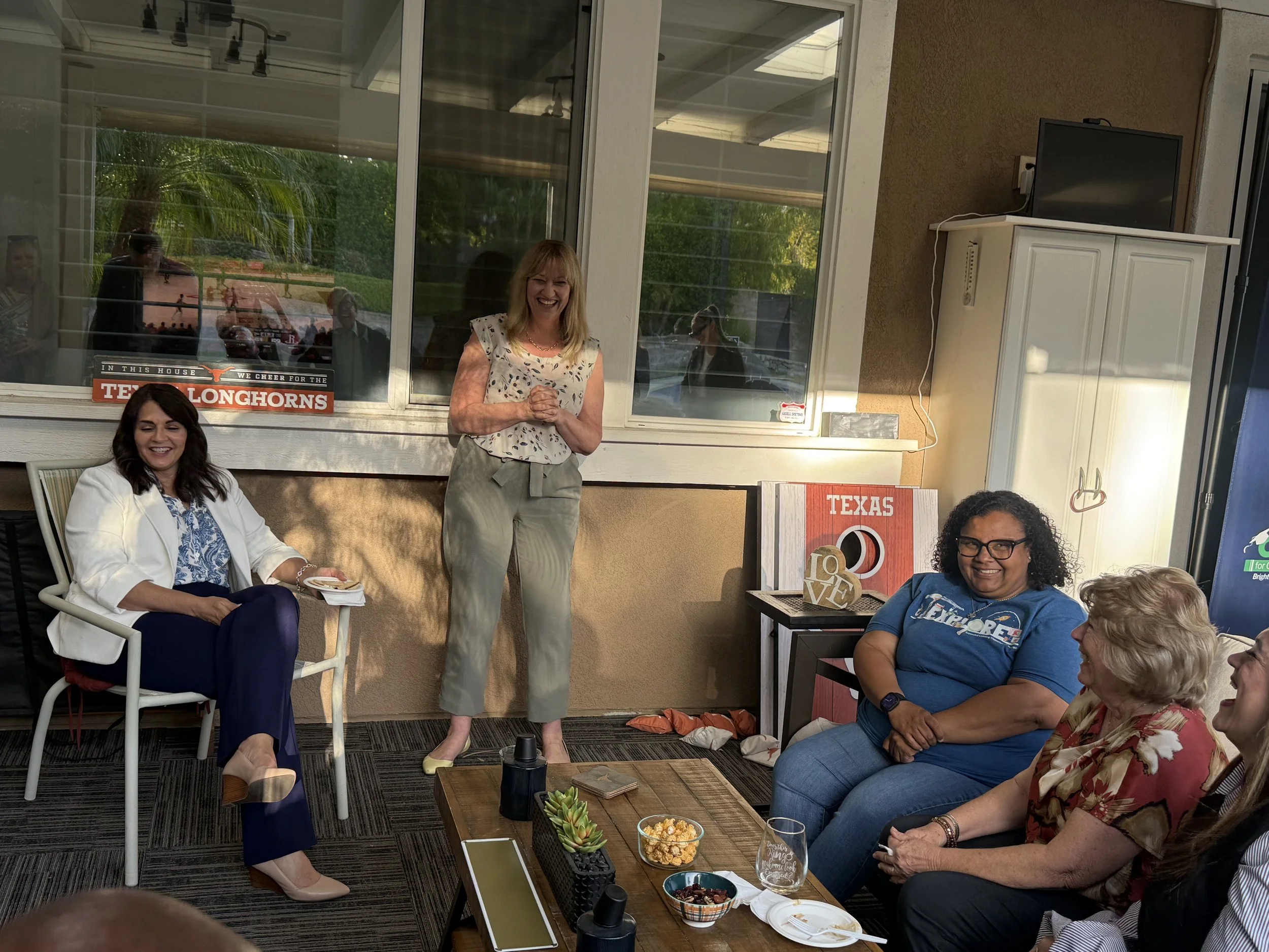 Cali speaking to a crowd of community members
