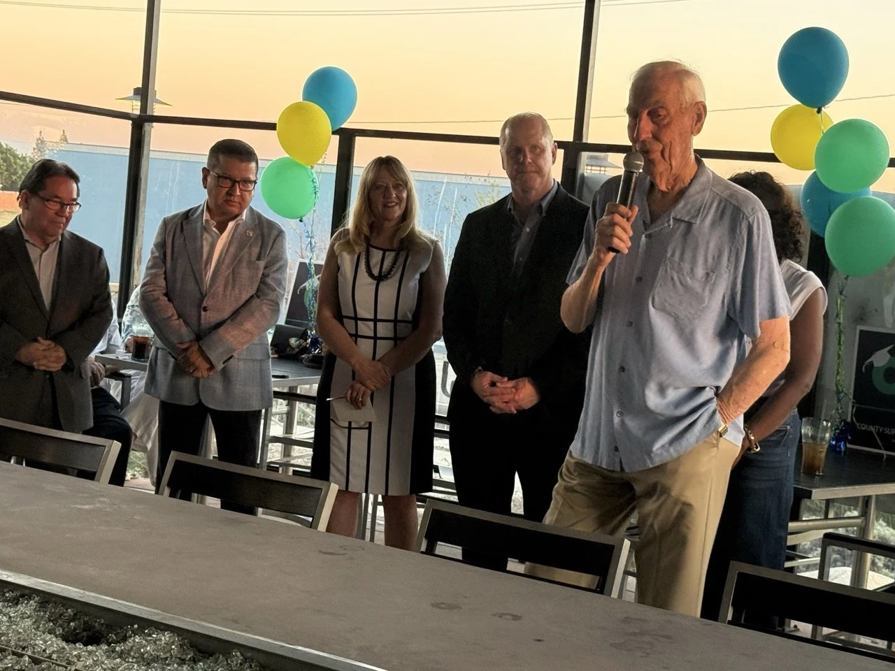 Dr. Herb Fischer speaking to the event guests about why he is endorsing Cali.