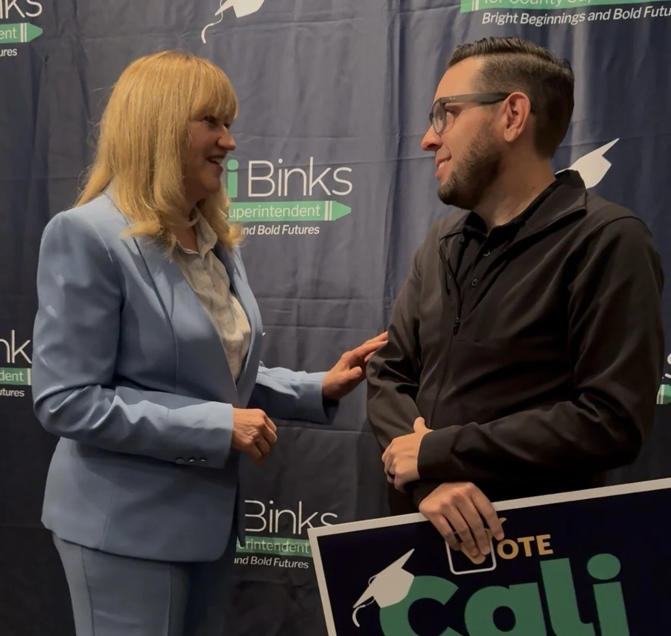 Cali speaking to a community member