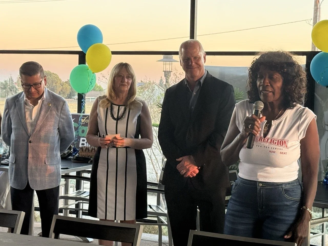 Mayor Acquanetta Warren speaking to the event guests about why she is endorsing Cali.