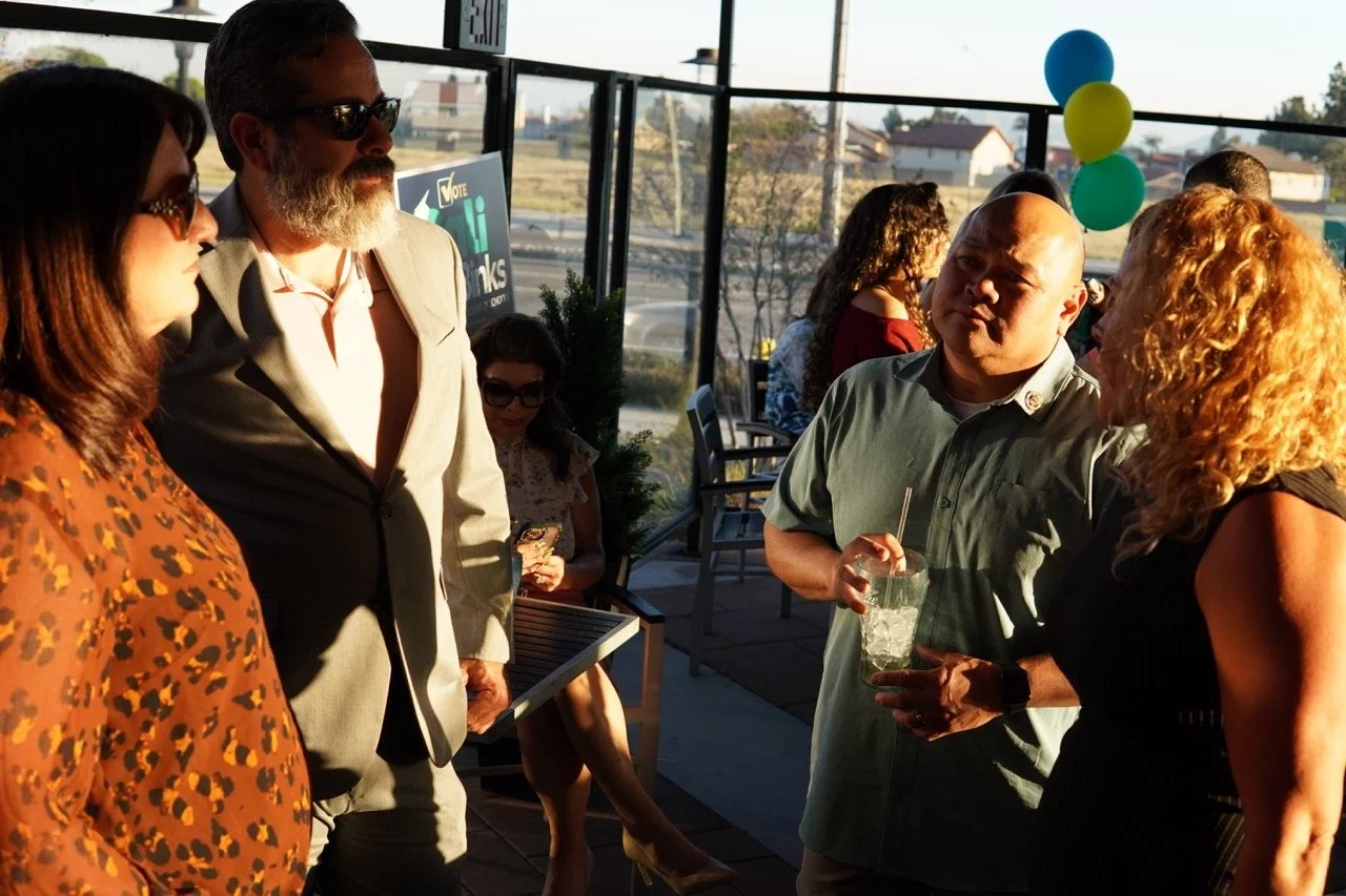 SEBA members having a conversation with a guest.