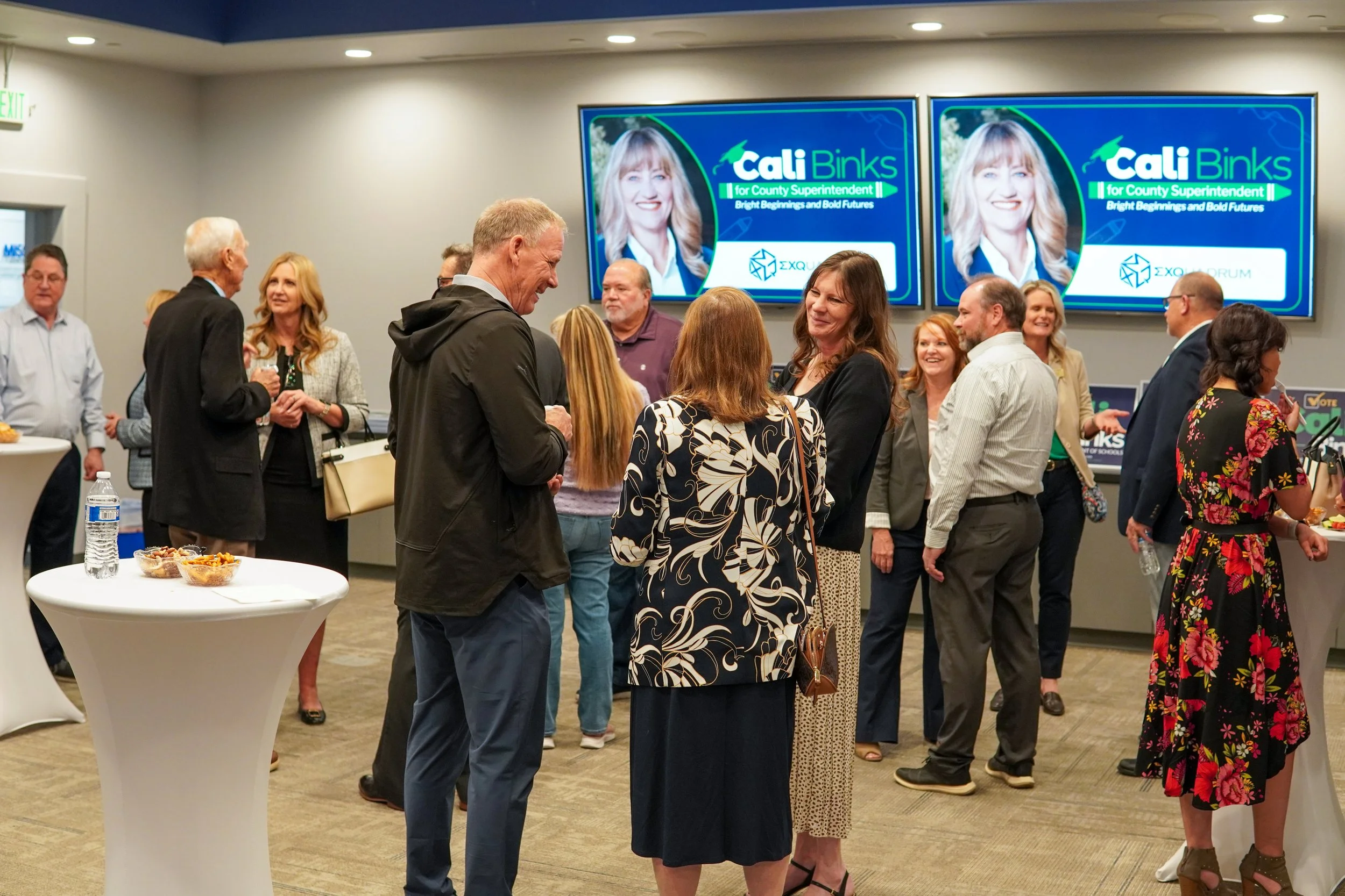 Group of community members networking at the event.