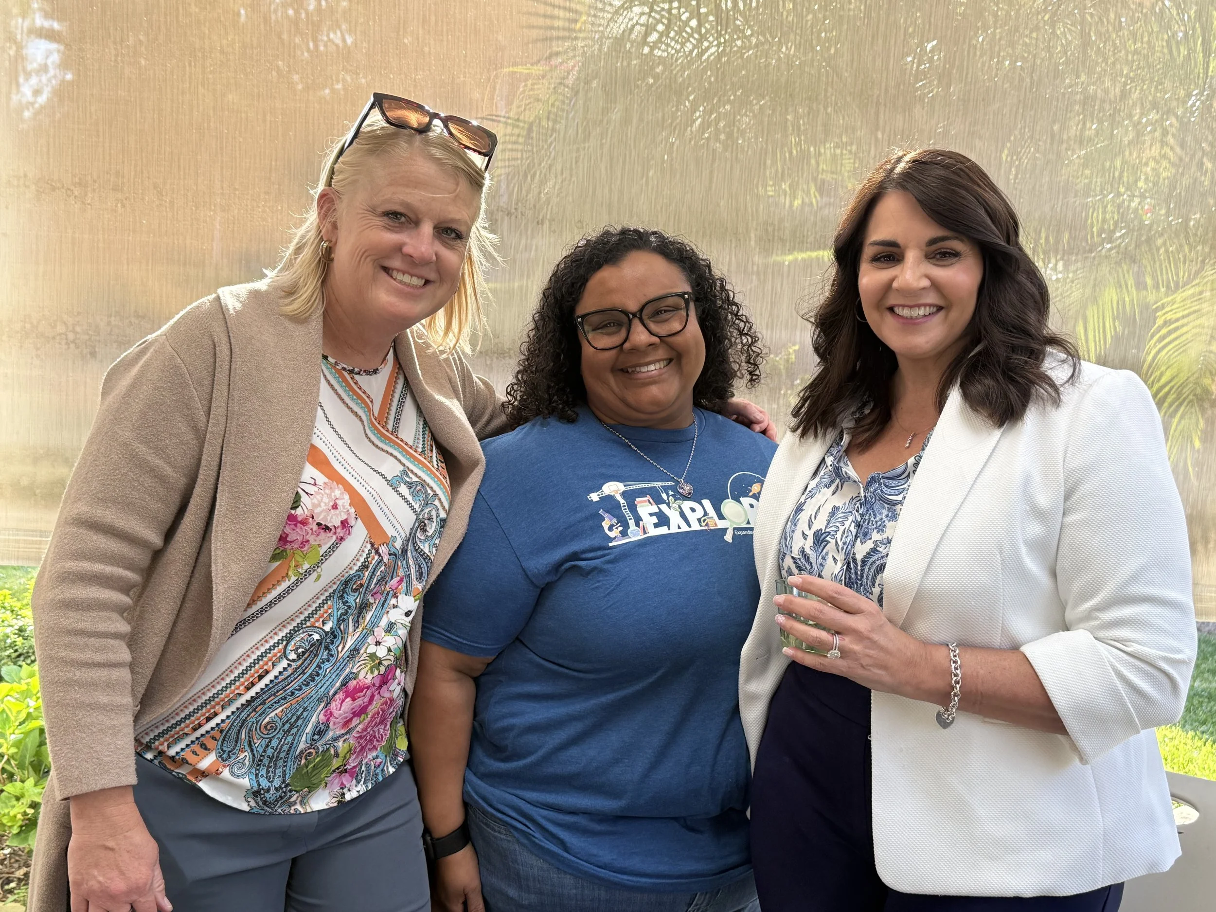 Three community members posing for the photo