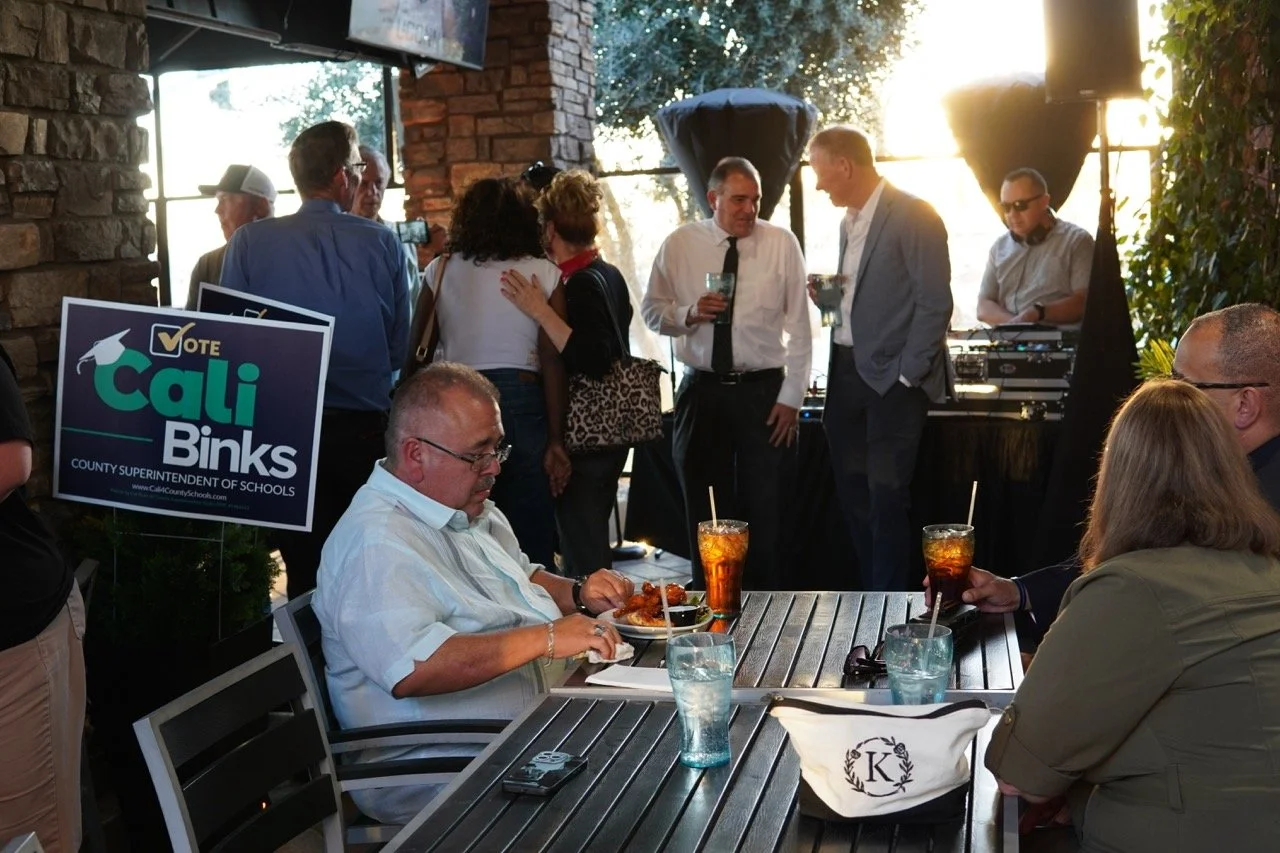 Crowd of guests networking at the event.