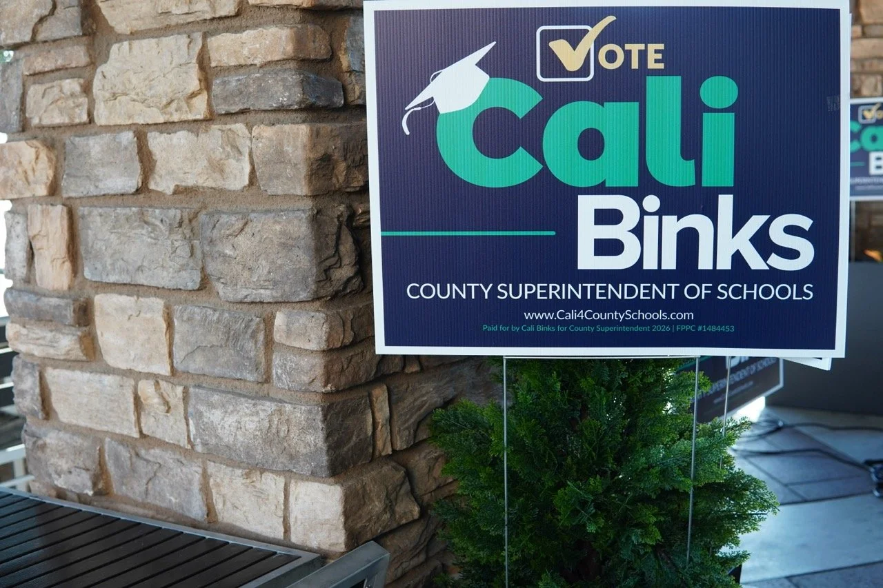 Yard sign with the text, "Vote Cali Binks, County Superintendent of Schools, campaign website address and FPPC number and blurb.