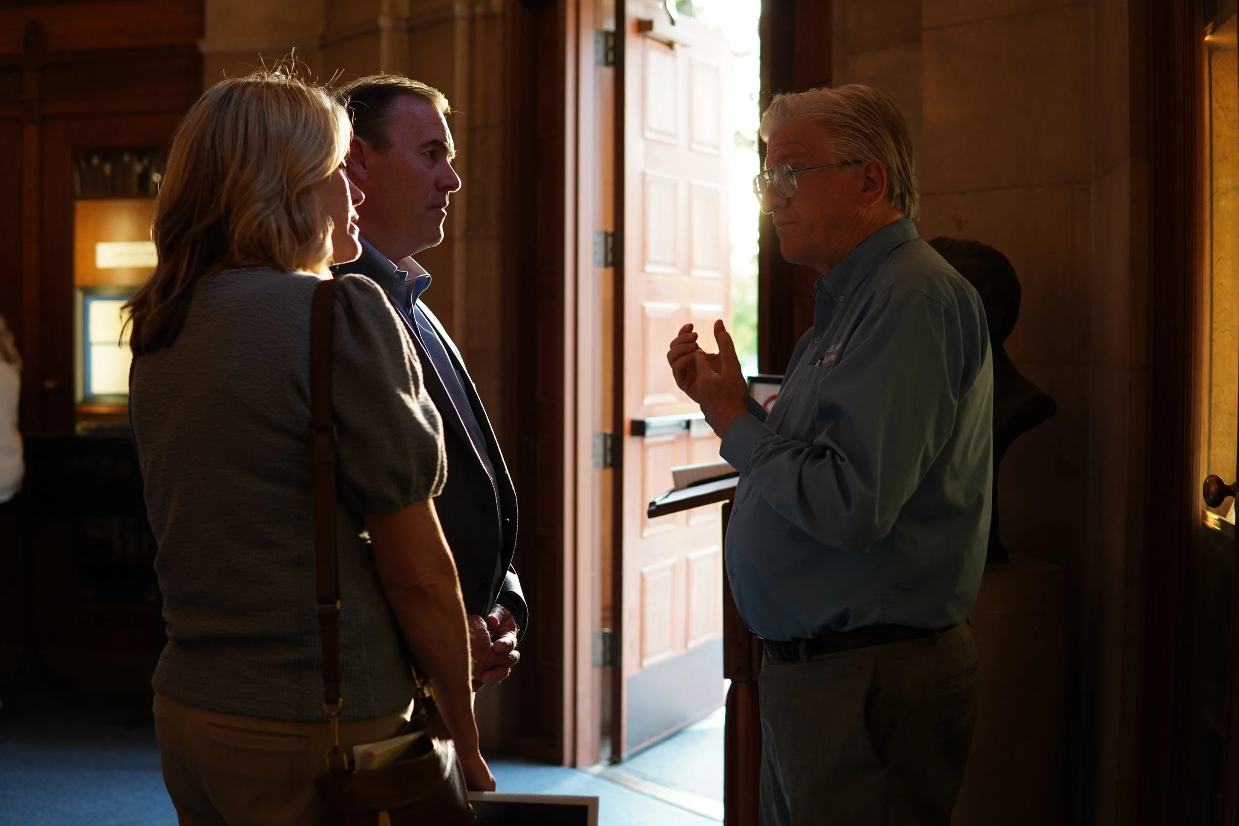 Three community members speaking