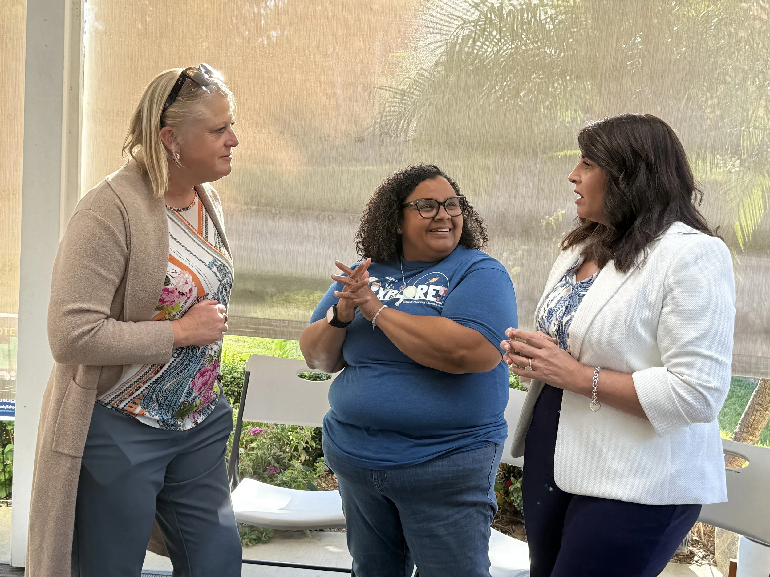 Three community members networking