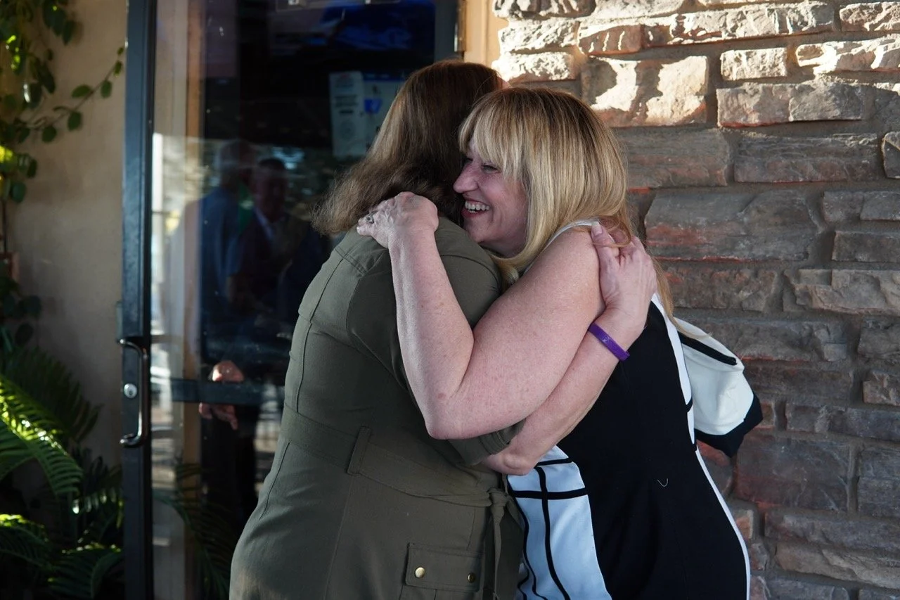 Kimberly MacKinney hugging Cali.