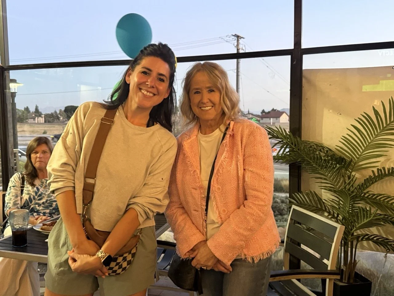 Cali posing with a community member.