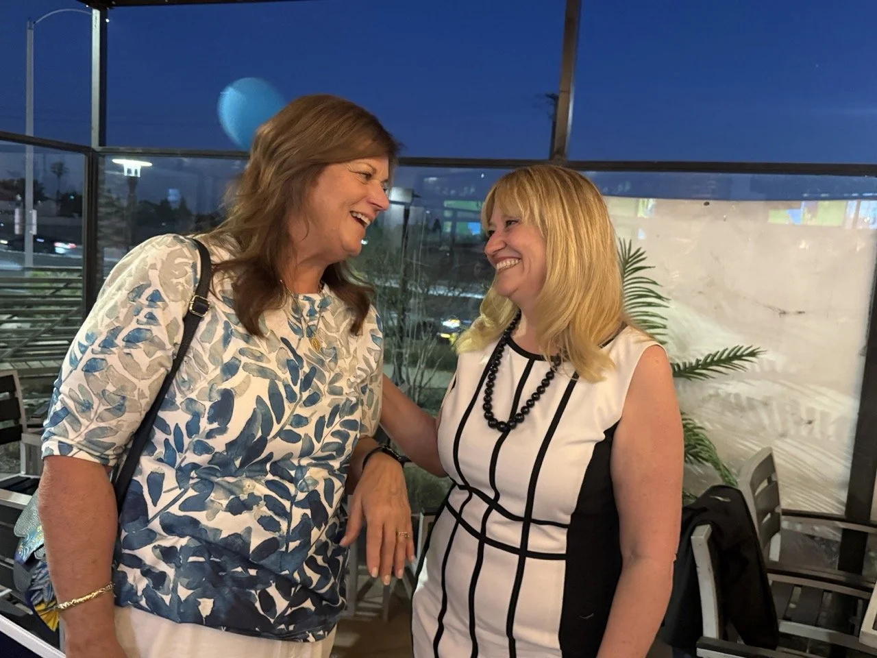 Cali speaking to guest.