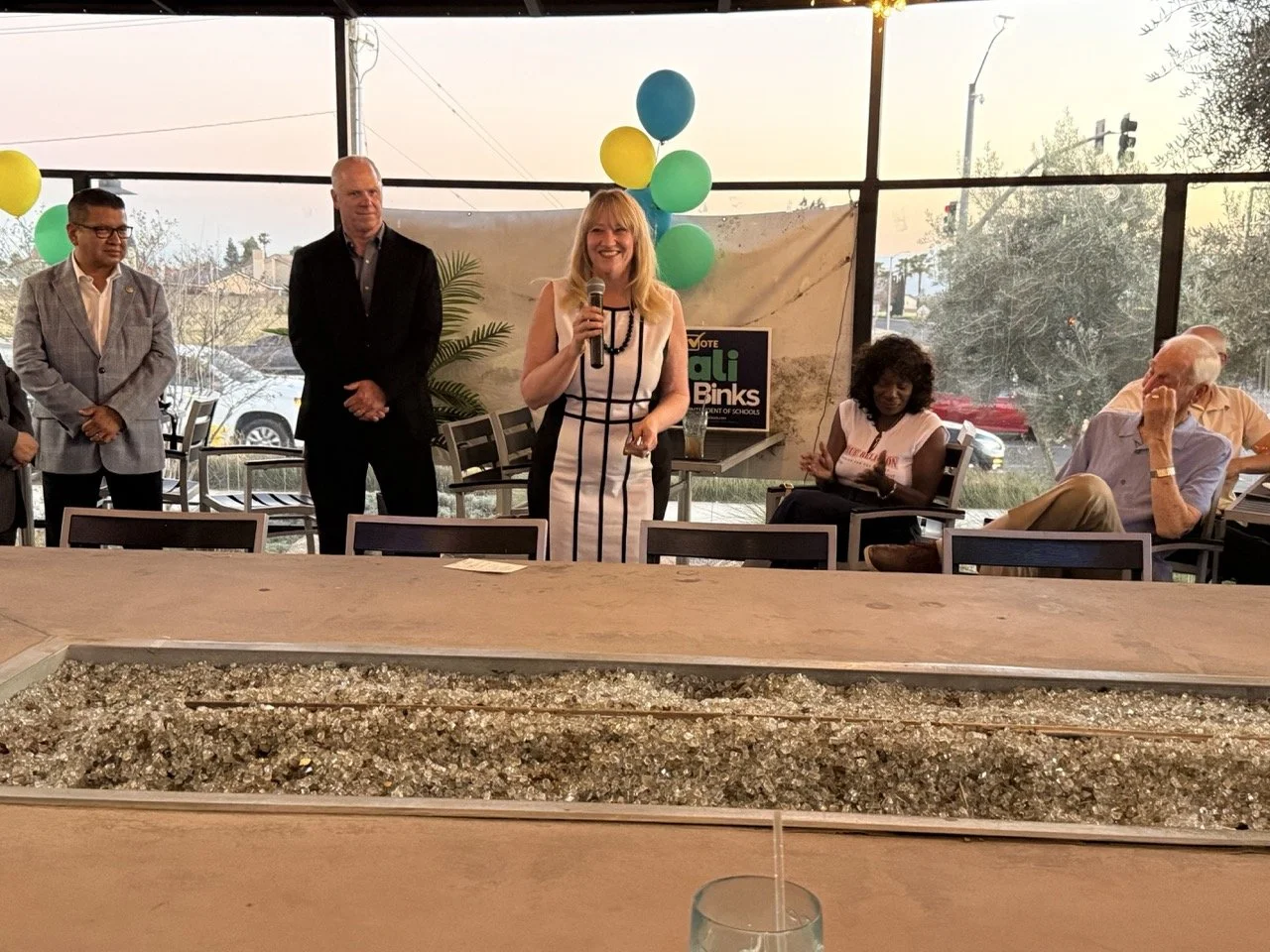 Cali speaking to the event guests.