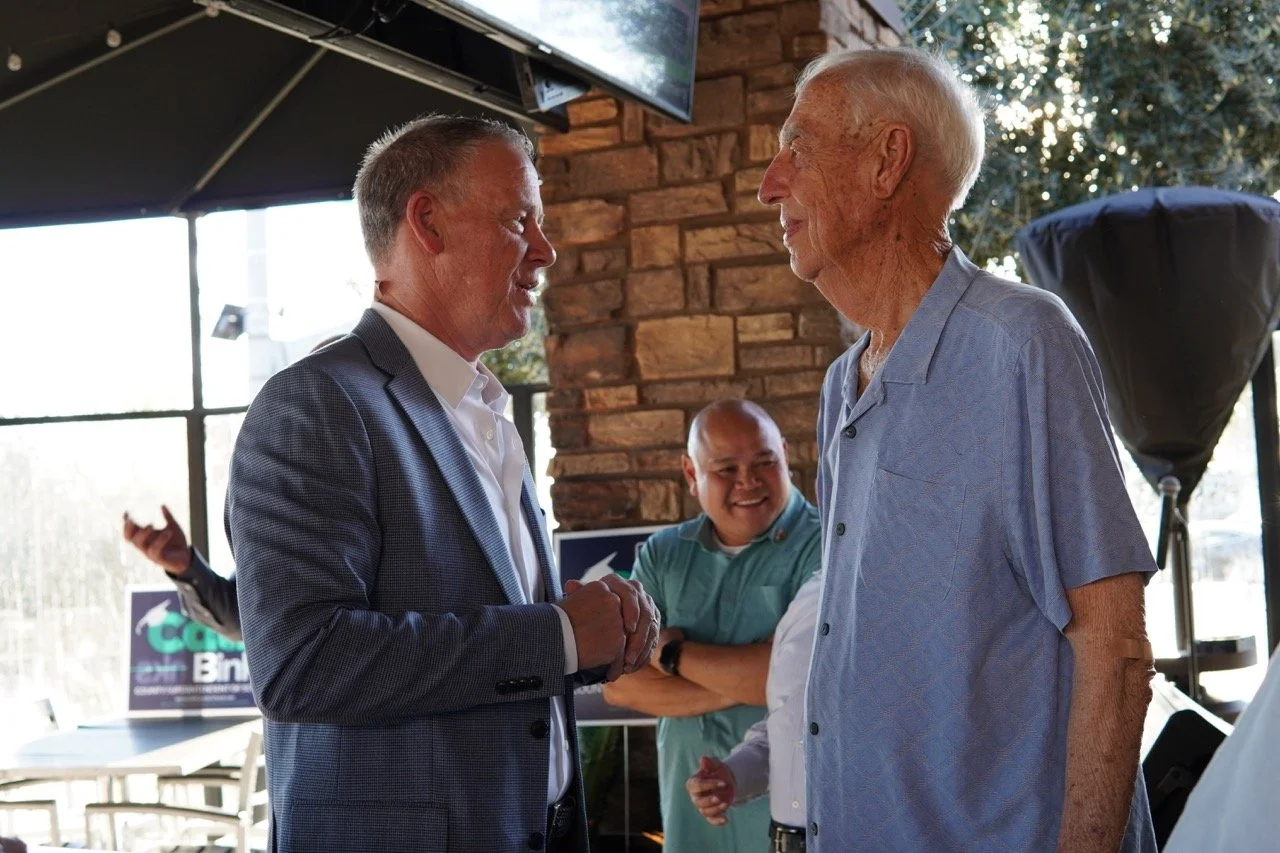 Dale Marsden speaking to Dr. Fischer.