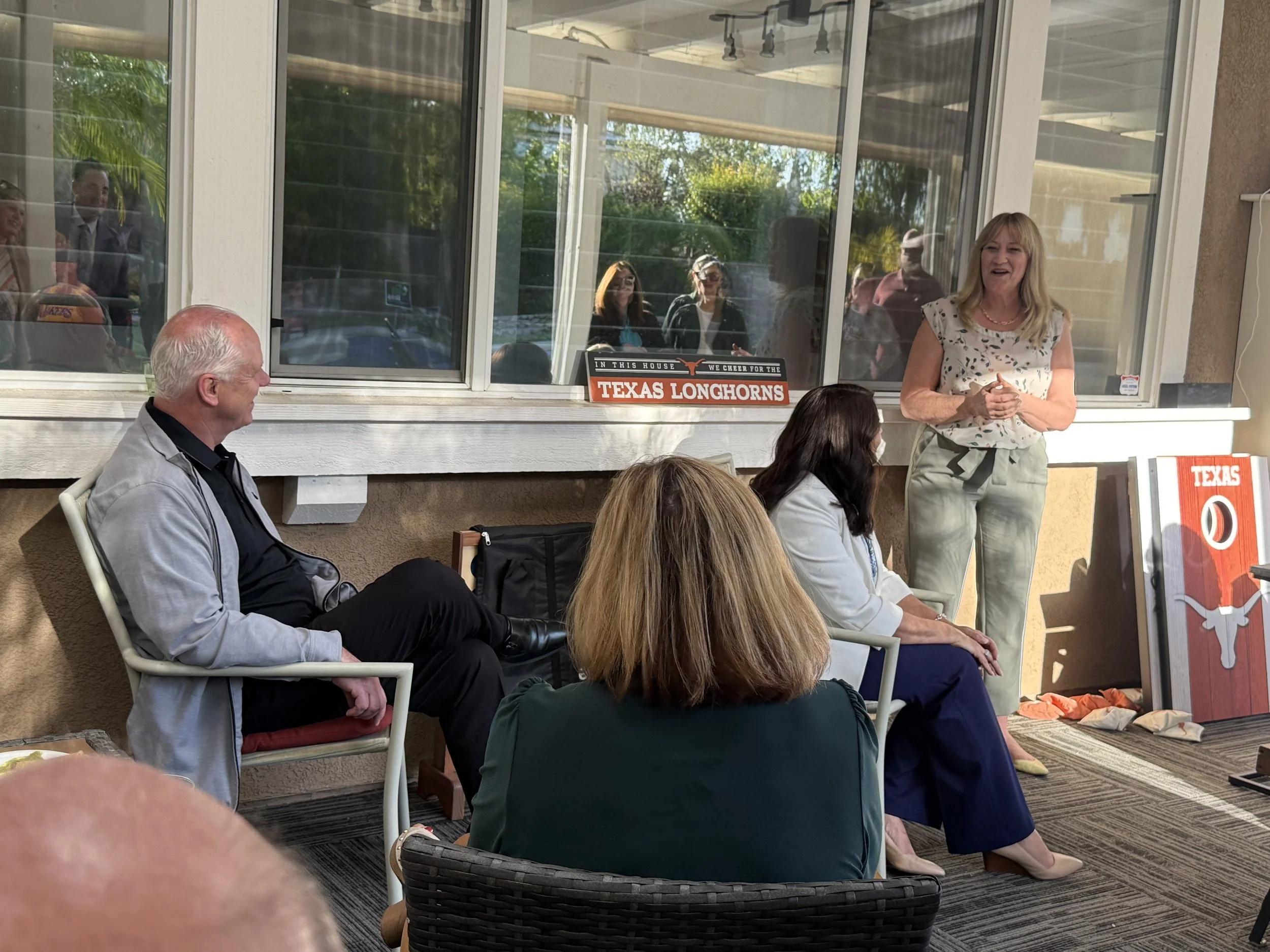 Cali speaking to a crowd of community members