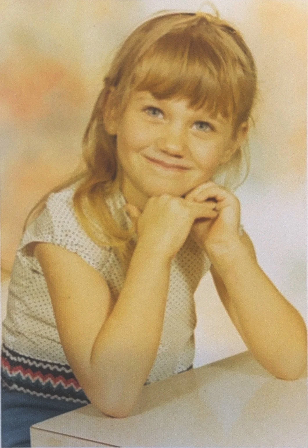 Cali as a young child in kindergarten.