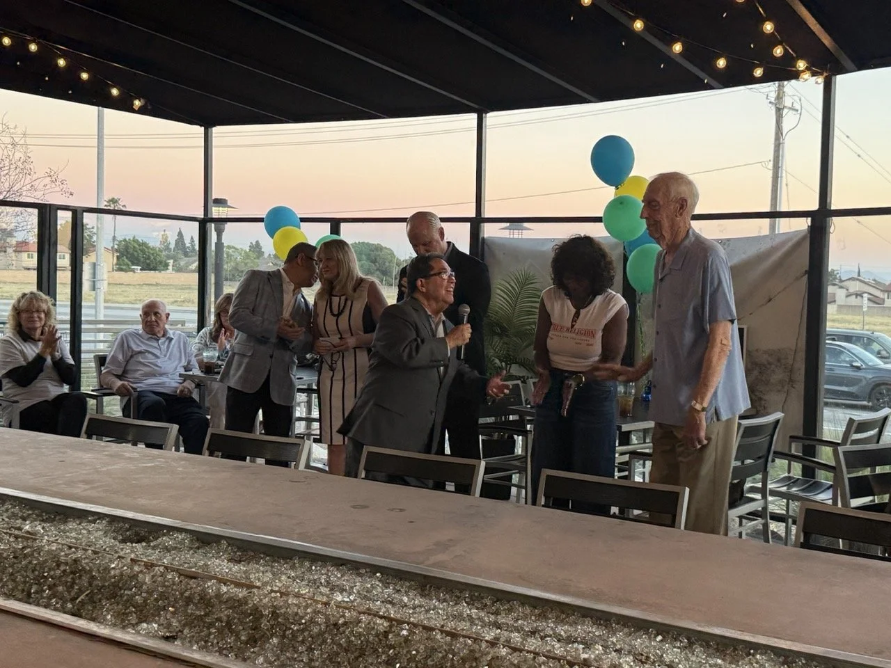 Norm speaking to the crowd about Dr. Herb Fischer.