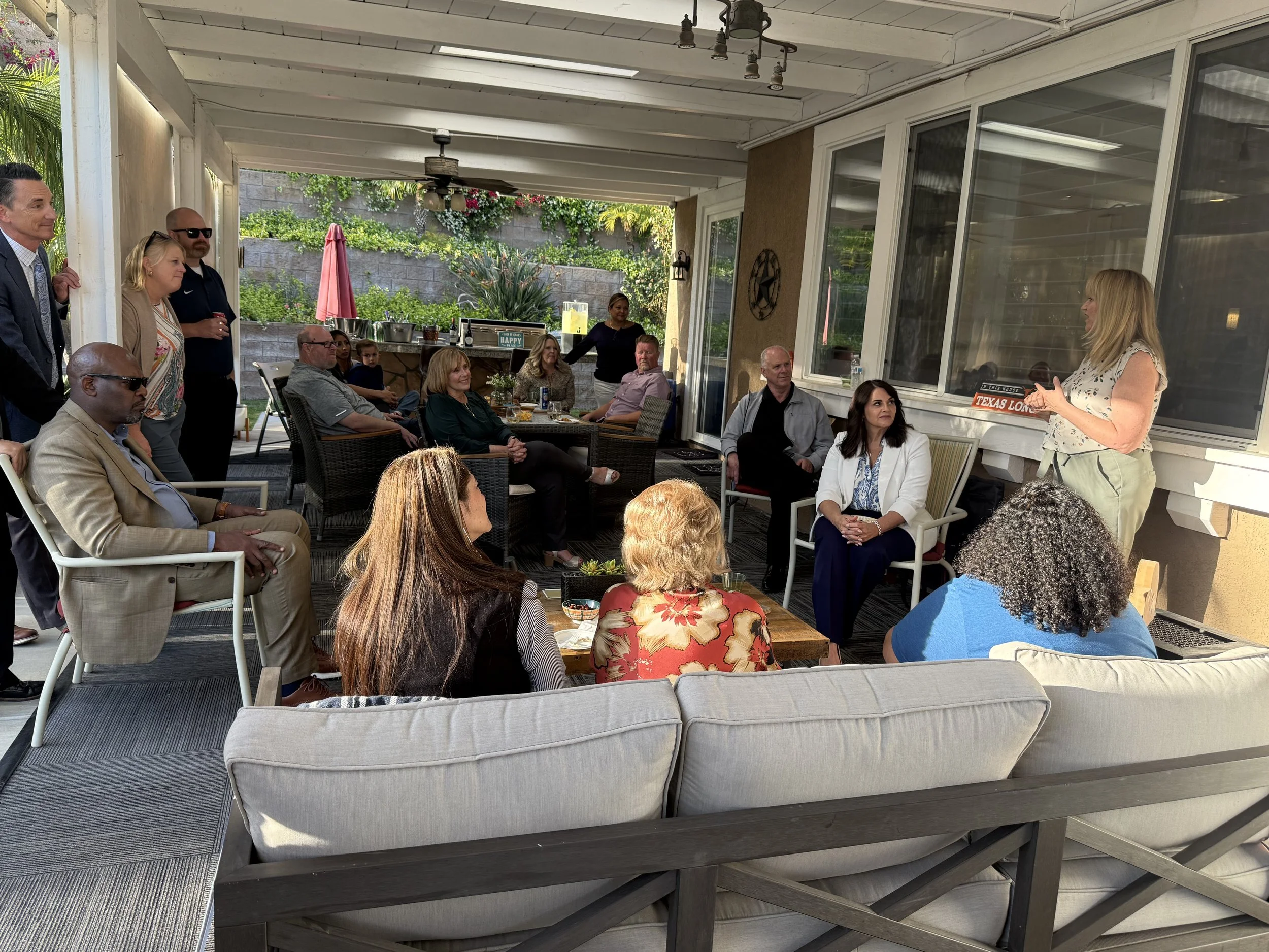 Cali speaking to a crowd of community members