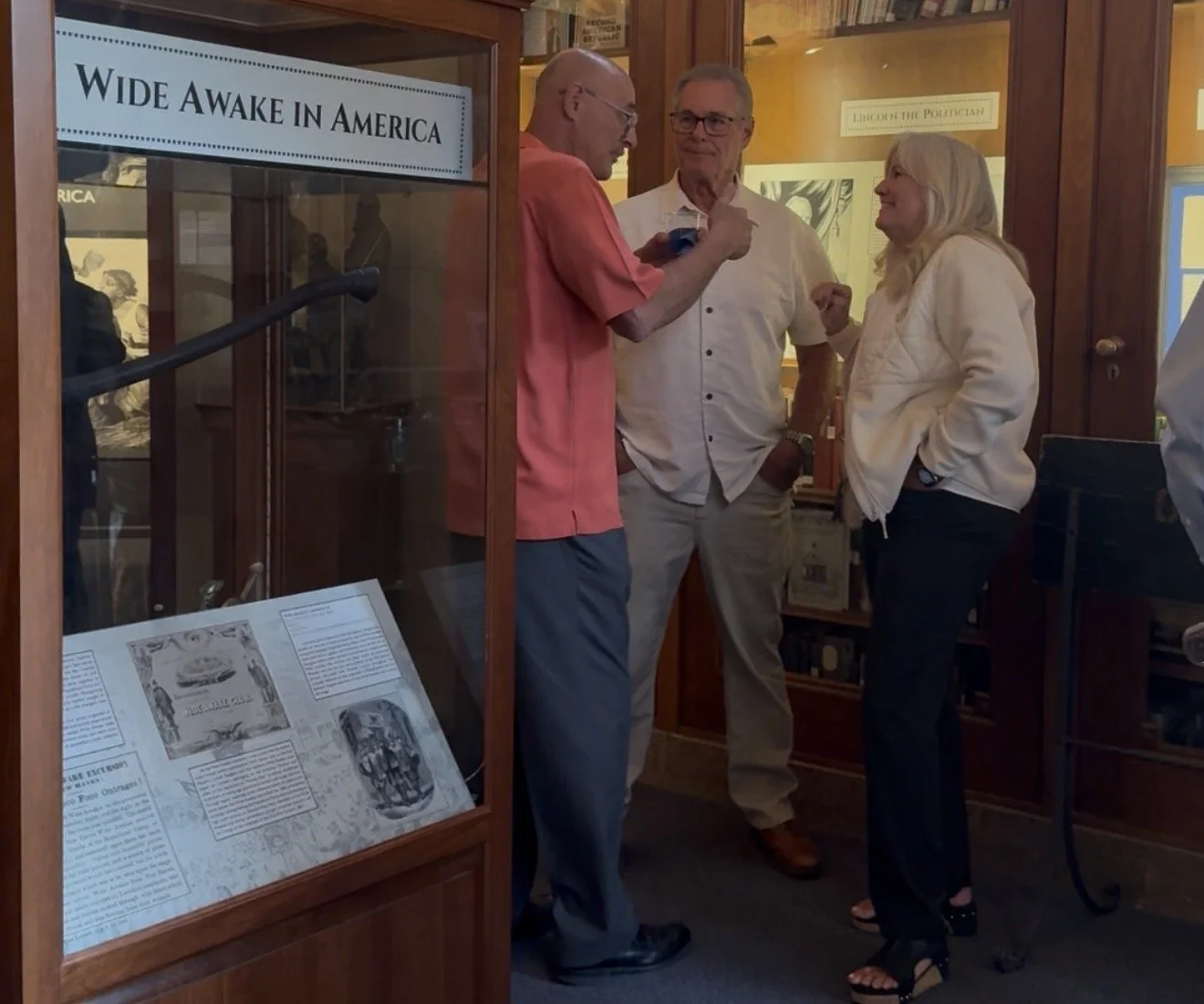 Three community members networking at the event