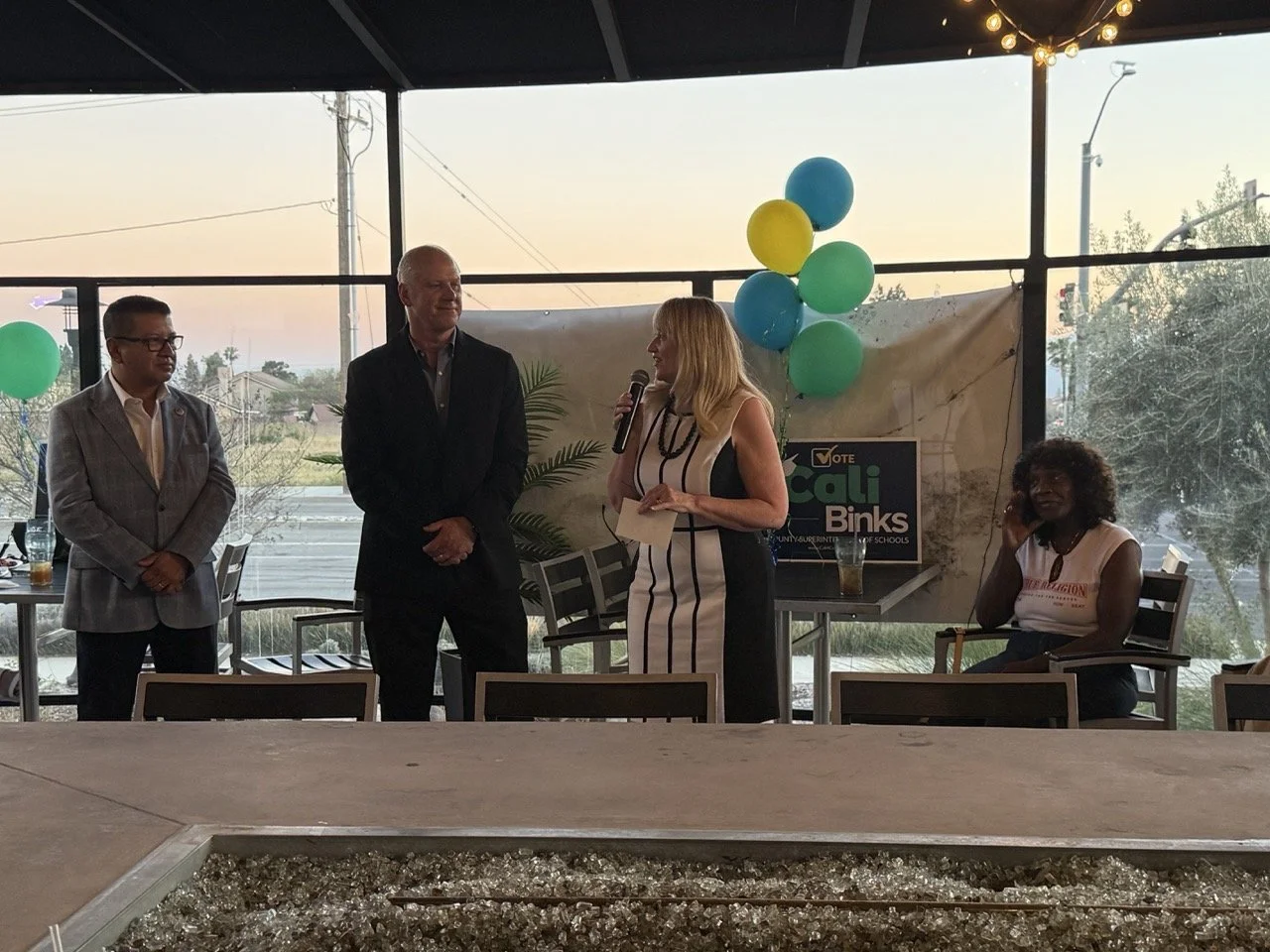 Cali speaking to the event guests.