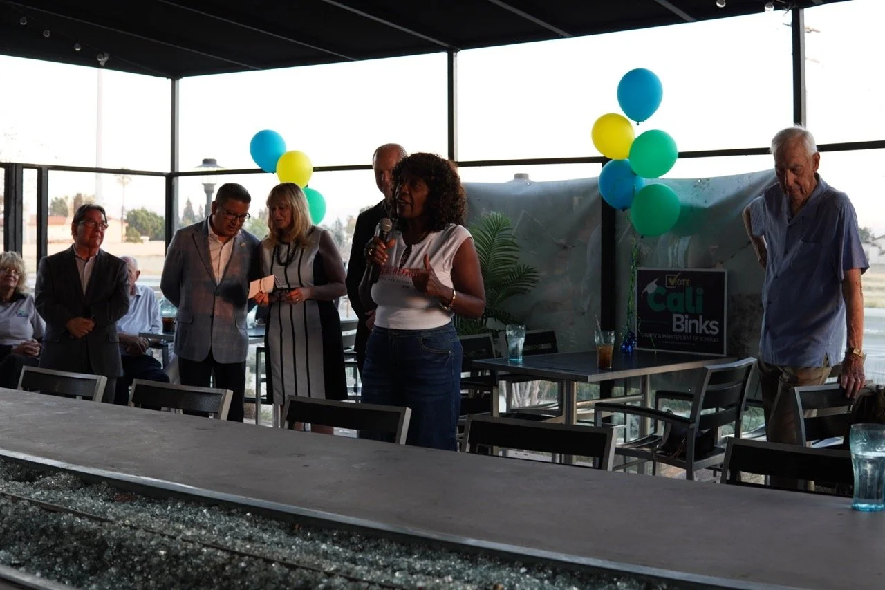 Mayor Acquanetta Warren speaking to the guests about her support for Cali.