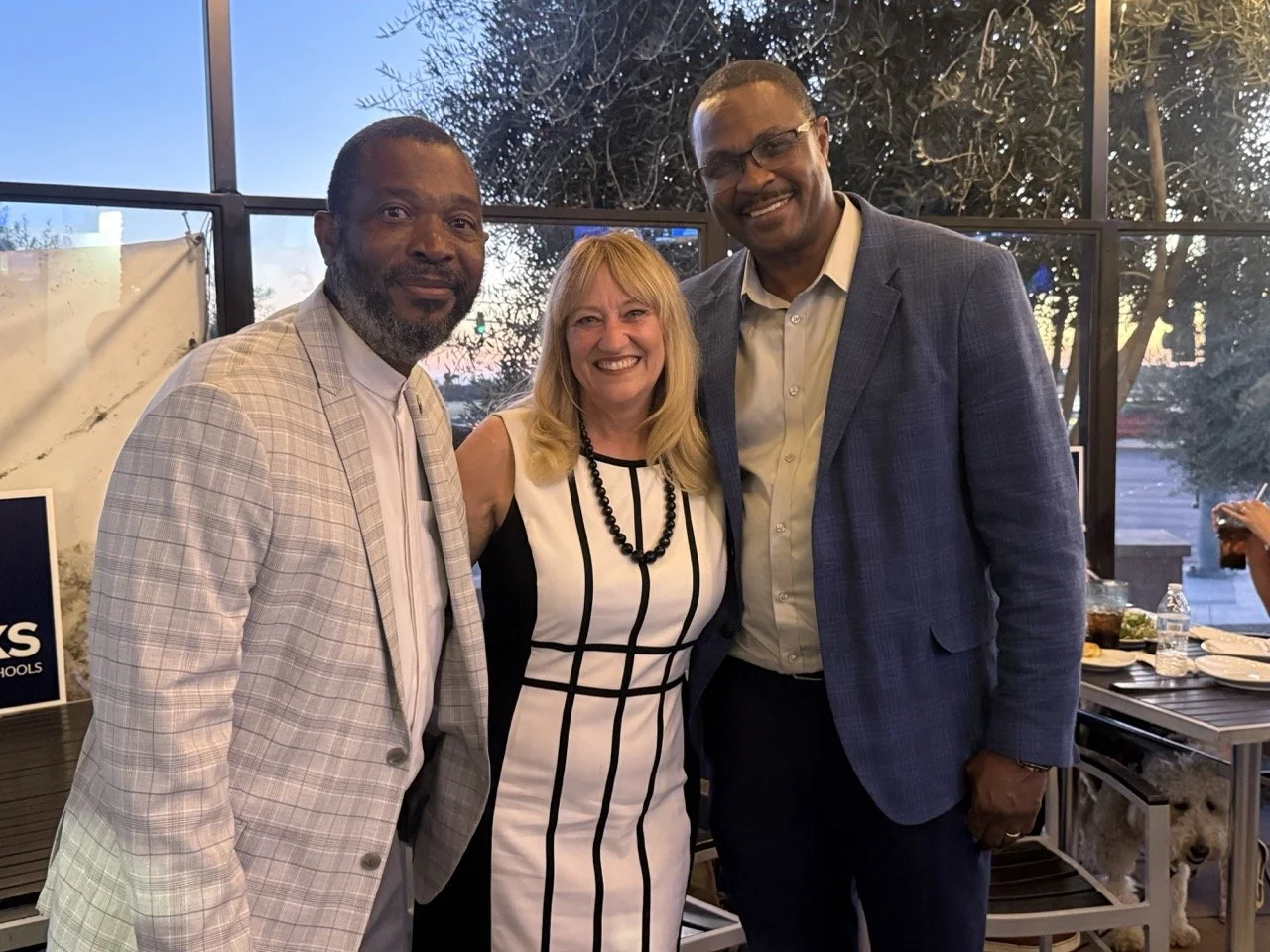 Cali posing with Chief Polimo, retired chief of police for San Bernardino Unified School District and guest.