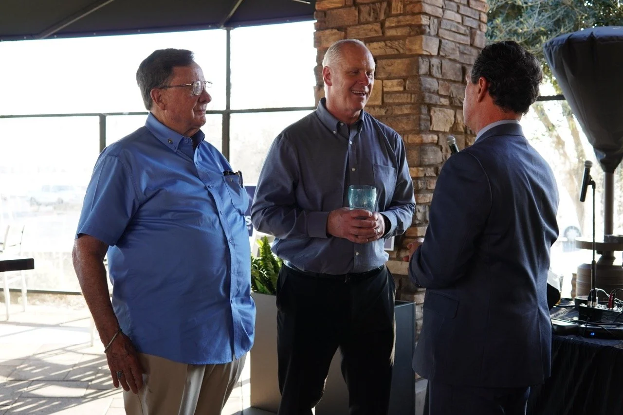 District Attorney Jason Anderson, Cali Bink's husband and a John Roberts, Fontana City Council having a conversation at the event.