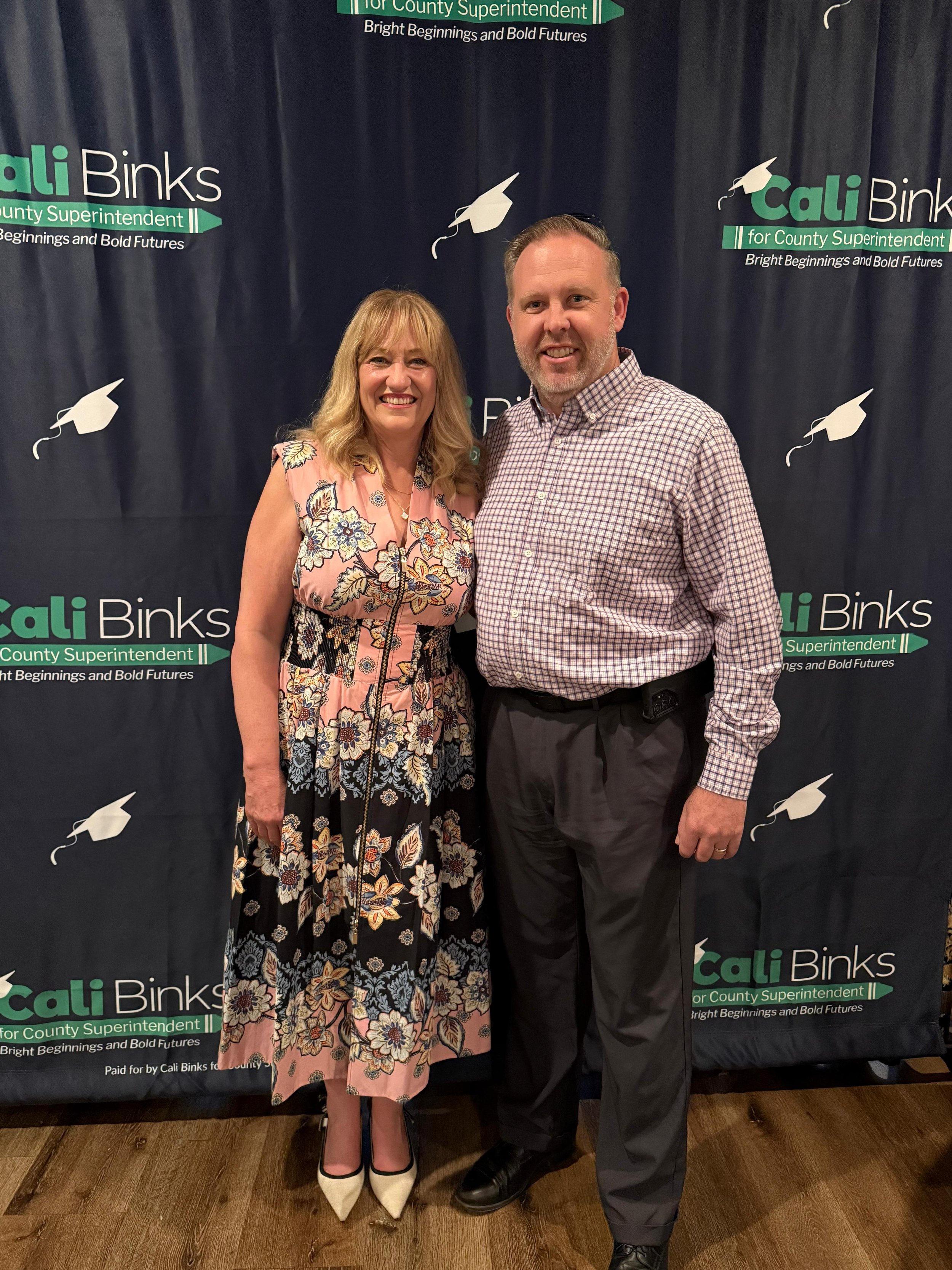 Cali Binks posing for a photo with a guest.