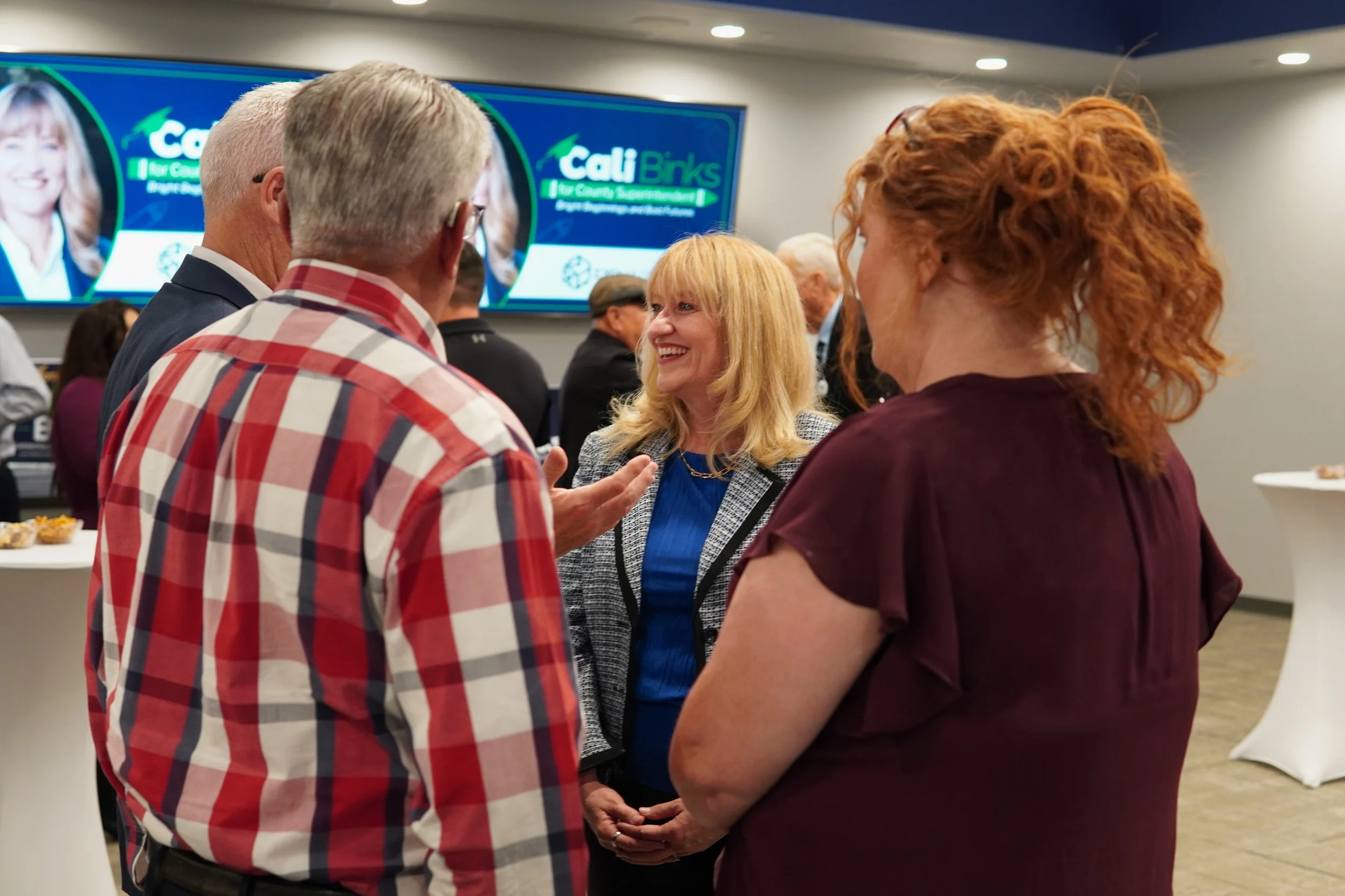 Community members networking with Cali