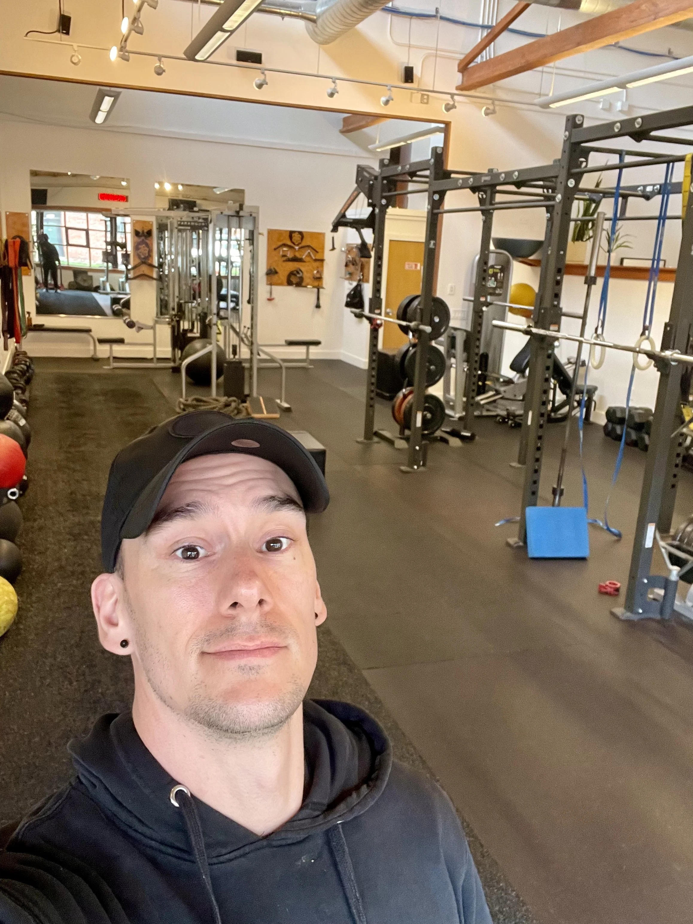 Milo Fox, gay personal trainer in Portland. In gym setting