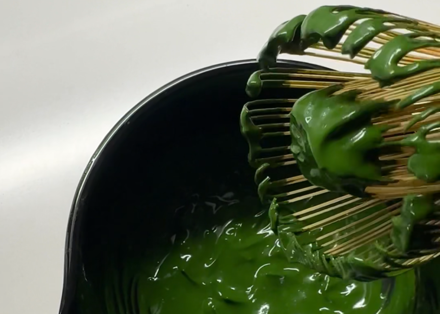 Koicha (matcha paste) on a bamboo whisk and matcha bowl