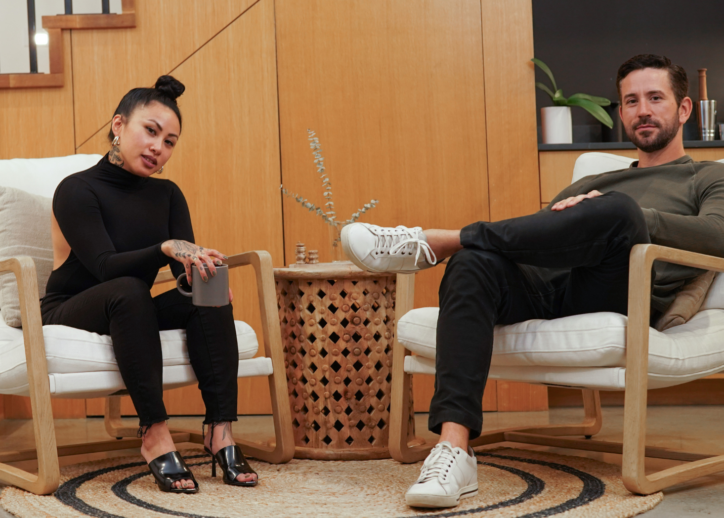 Matcha Program Educators Jules Reyes and Marc St Raymond sitting in a modern living space