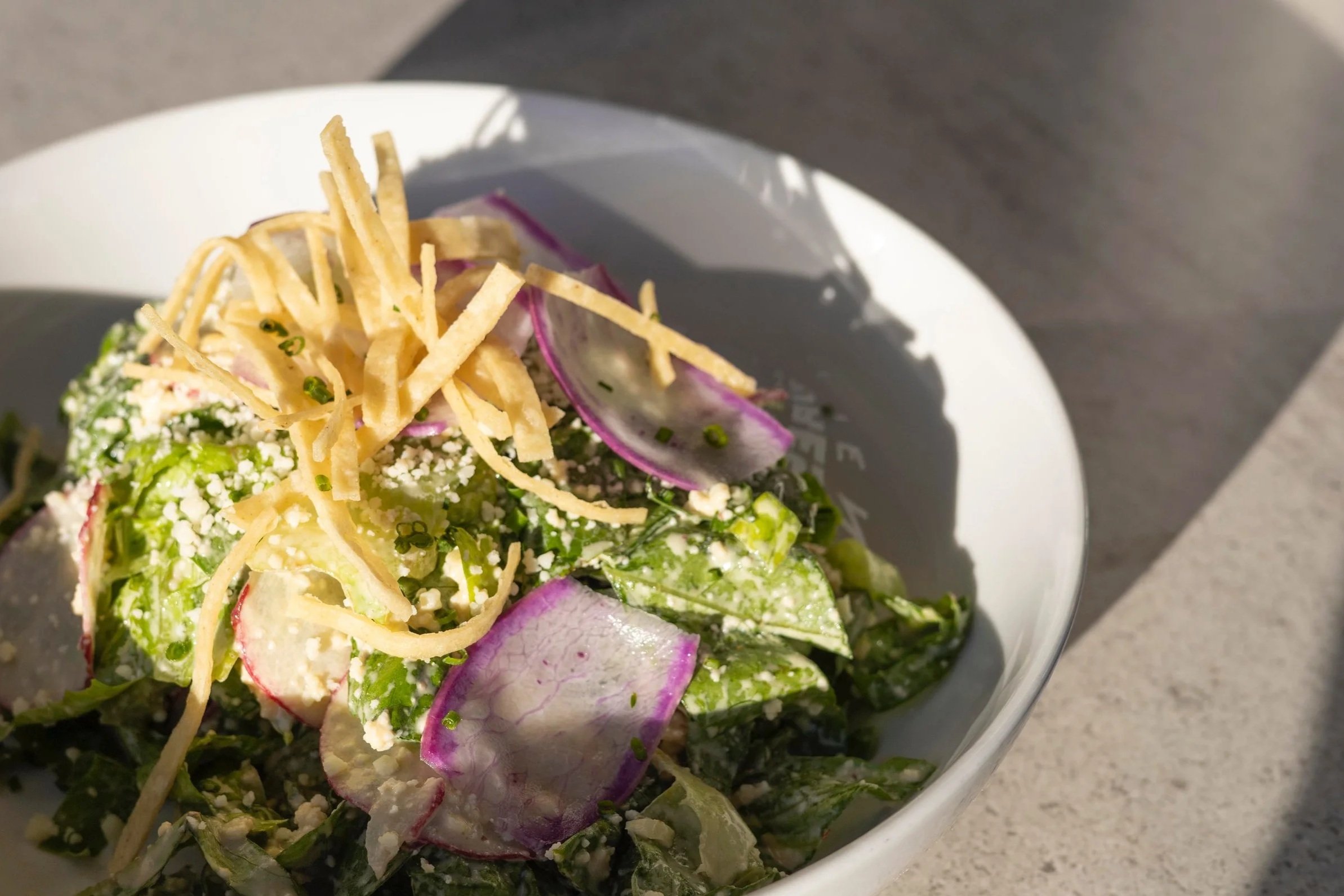 chopped romaine, shaved radish, chipotle caesar