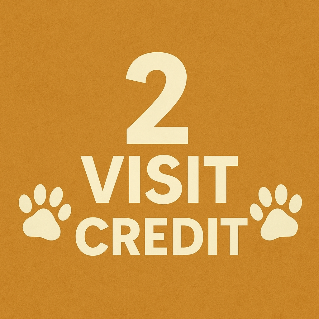 Sign with the text '2 Visit Credit' and paw print icons on a brown background.