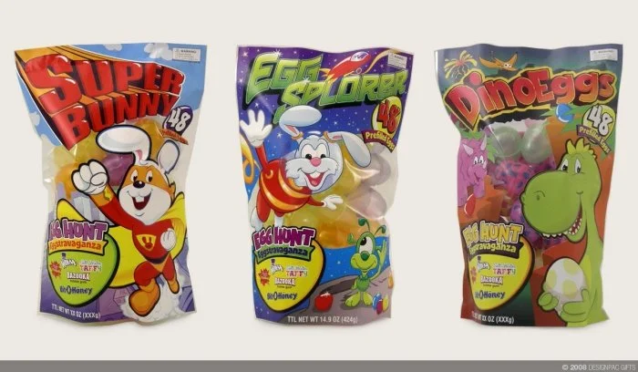 Three colorful bags of Taffy candies featuring cartoon characters from Nickelodeon shows: Super Bunny, Eggzellerator, and Dino-eggs, each with the number 48 indicating the quantity inside.