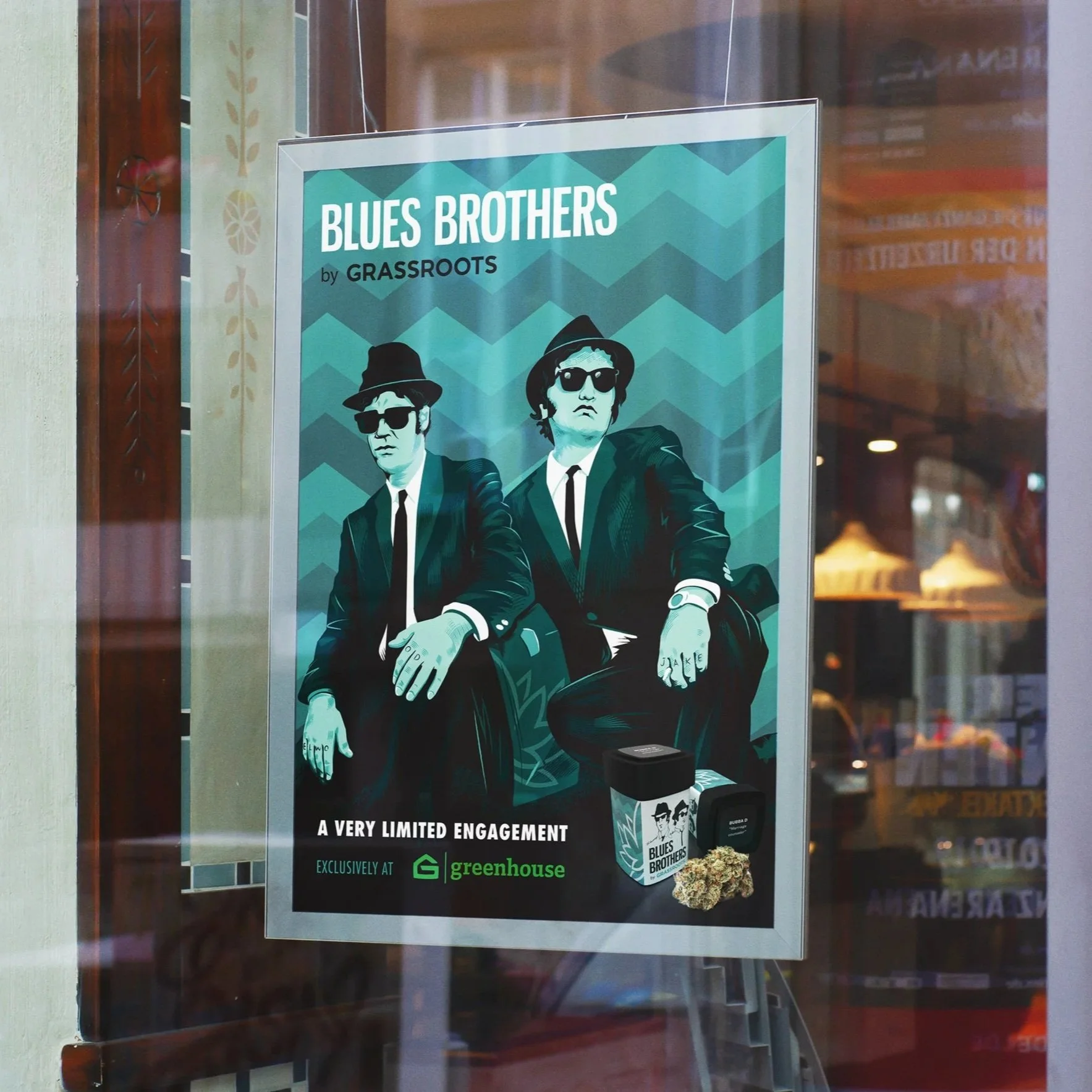Poster advertising the band Blues Brothers, with stylized image of two men in suits and sunglasses, and a Greenhouse cannabis dispensary branding.