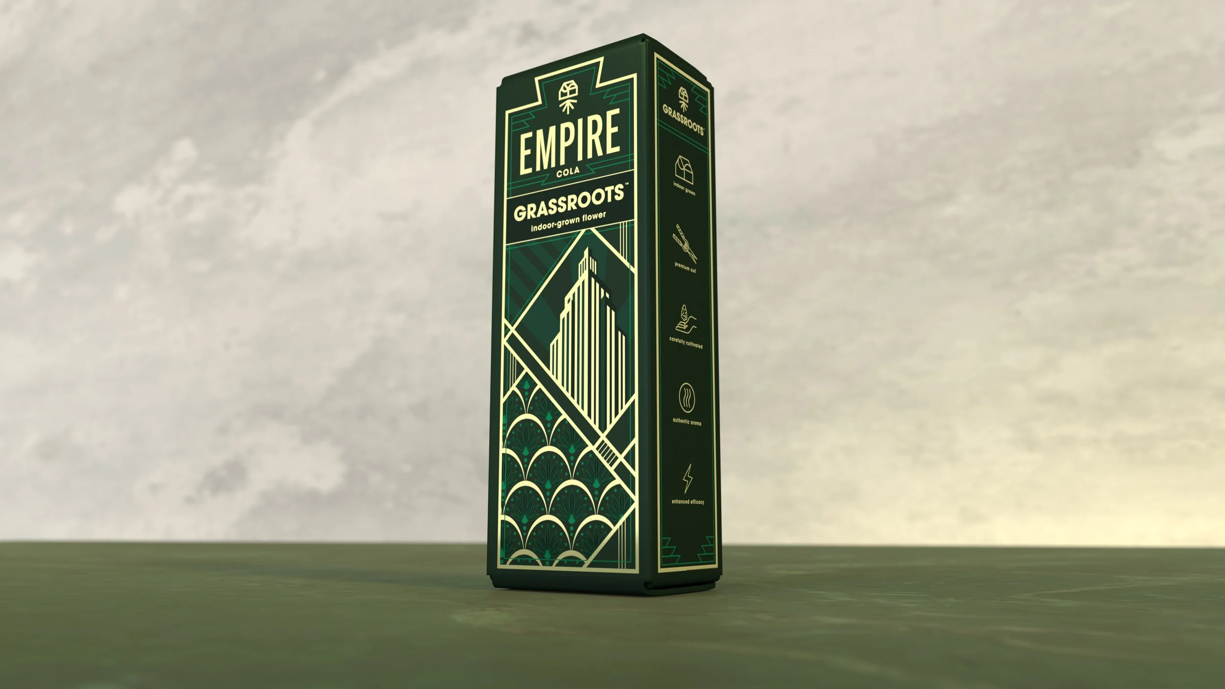 A tall, rectangular package of Empire Cola from Grassroots, standing on a wooden surface against a plain, textured background. The packaging features green and cream-colored geometric patterns and text.
