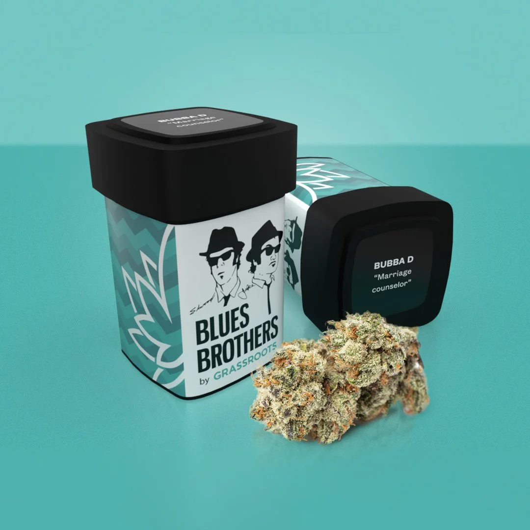 A cannabis product labeled as Blue Brothers by Grassroots, with a cannabis bud and a digital case for storage or display, and a container with a black lid labeled 'BUBBA D Marriage counselor'.