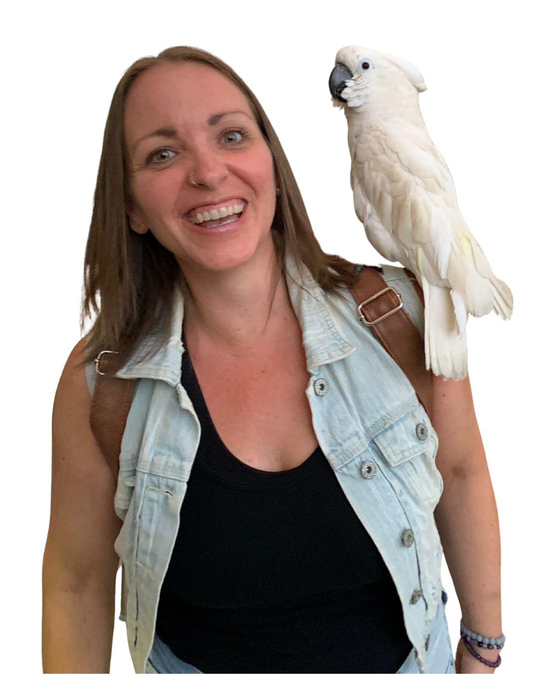 Megan Deaust smiling with a white cockatoo perched on her shoulder.