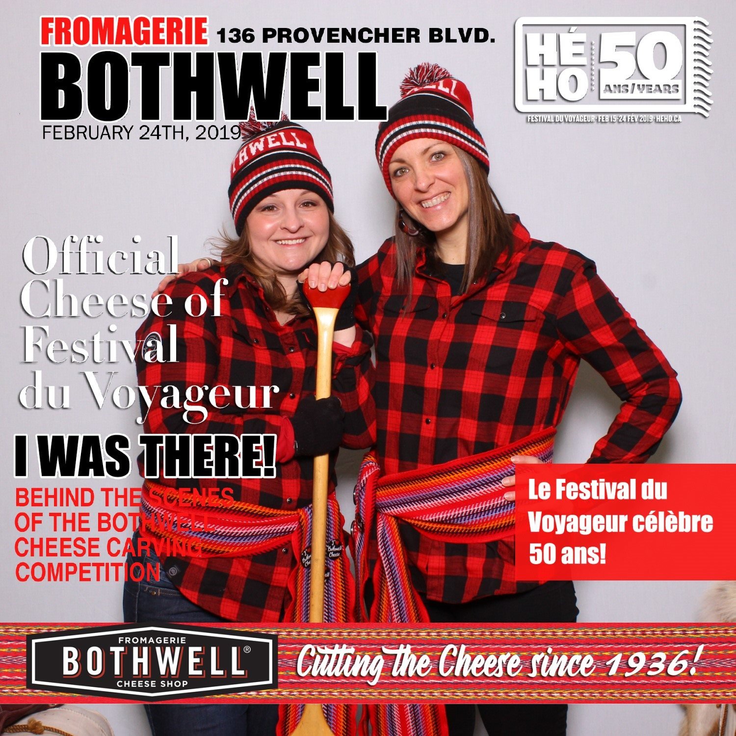 Krystal Stigandar and Megan Deaust wearing red and black plaid shirts and red, black, and white hats pose together, one holding a canoe paddle, in front of a gray background at the Bothwell cheese shop's cheese carving competition in February 2019.