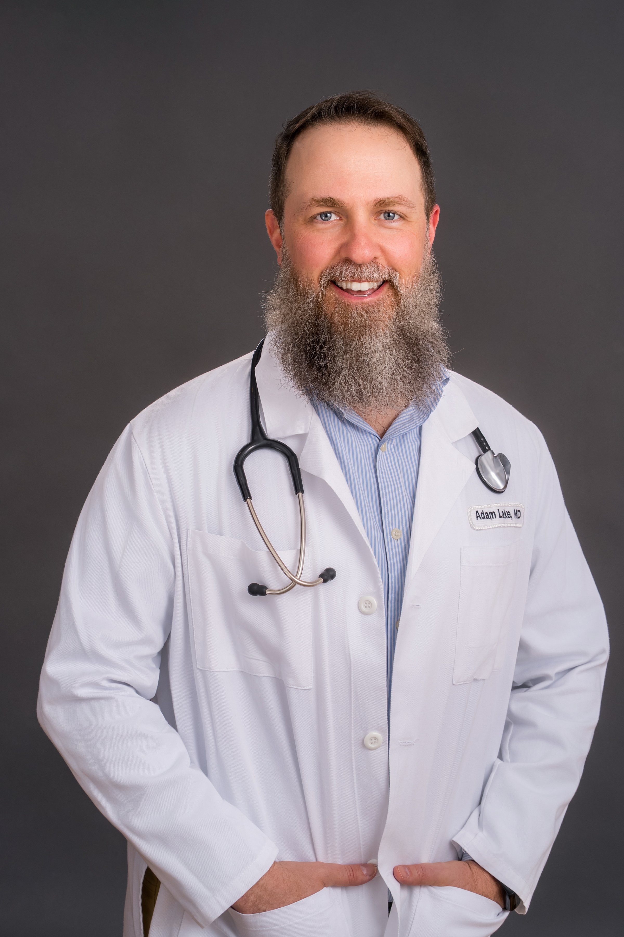 Smiling male gender affirming autism expert and diagnosis expert physician