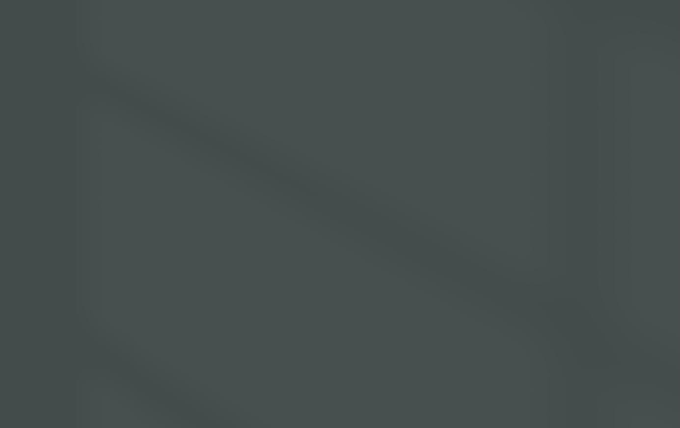 The image shows a close-up of black headphones resting on a dark surface, with a slight reflection of the headphones visible on the surface.