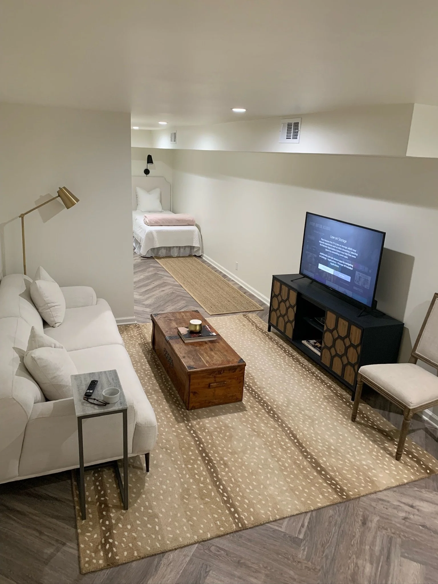 Finished basement renovation expanding the home’s usable living area through a well-planned layout, balanced lighting, and comfortable everyday functionality.