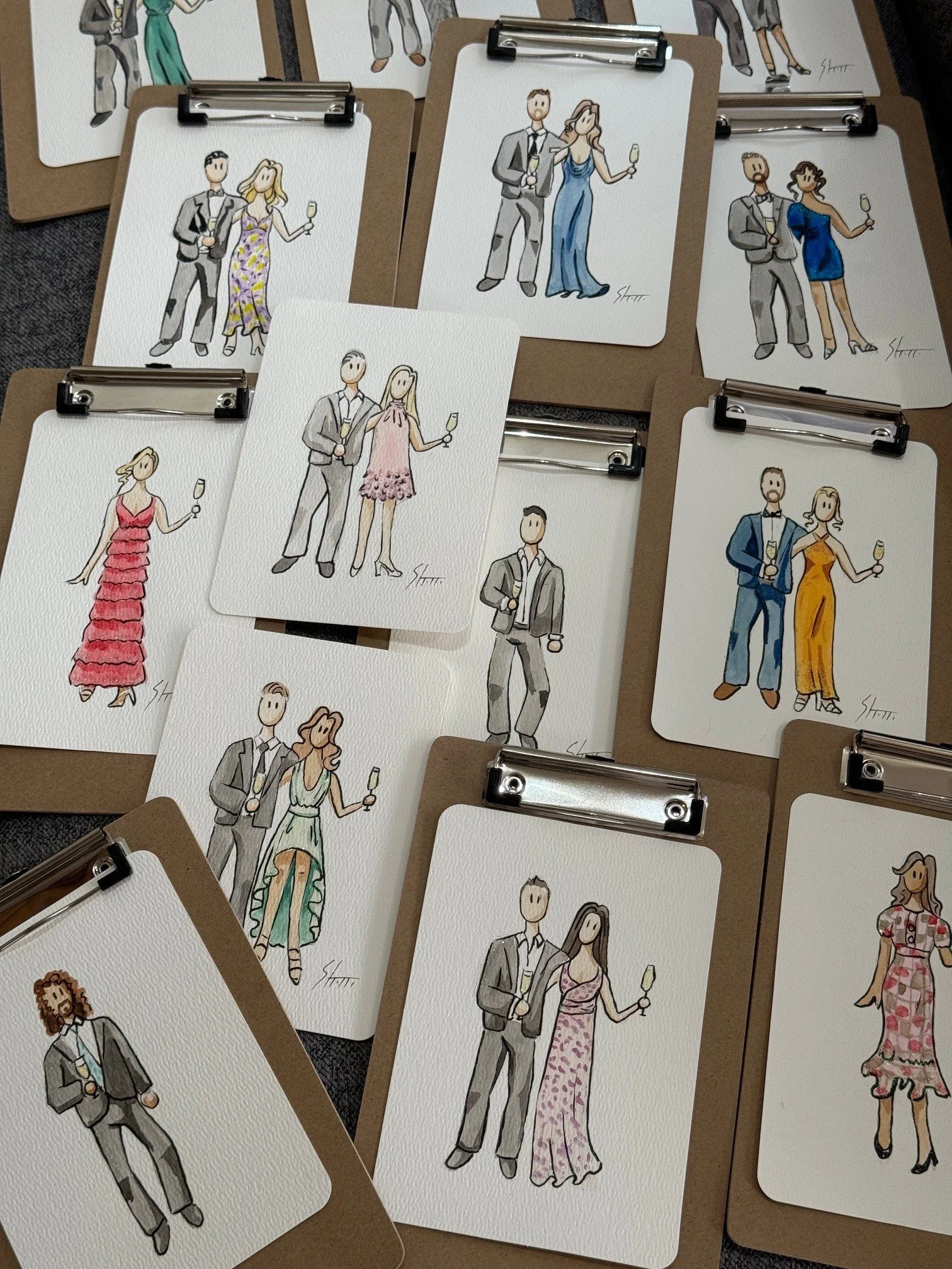 Illustrated party or wedding invitation cards with couples in formal attire, each holding a glass of champagne, arranged on brown clipboards.
