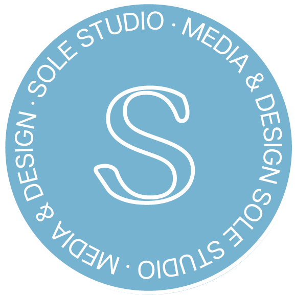 Light blue circular logo with a white border. Center features a large stylized letter 'S'. Surrounding the 'S' is white text that reads 'MEDIA & DESIGN • SOLE STUDIO • MEDIA & DESIGN STUDIO • SOLÉ STUDIO • DESIGN'.