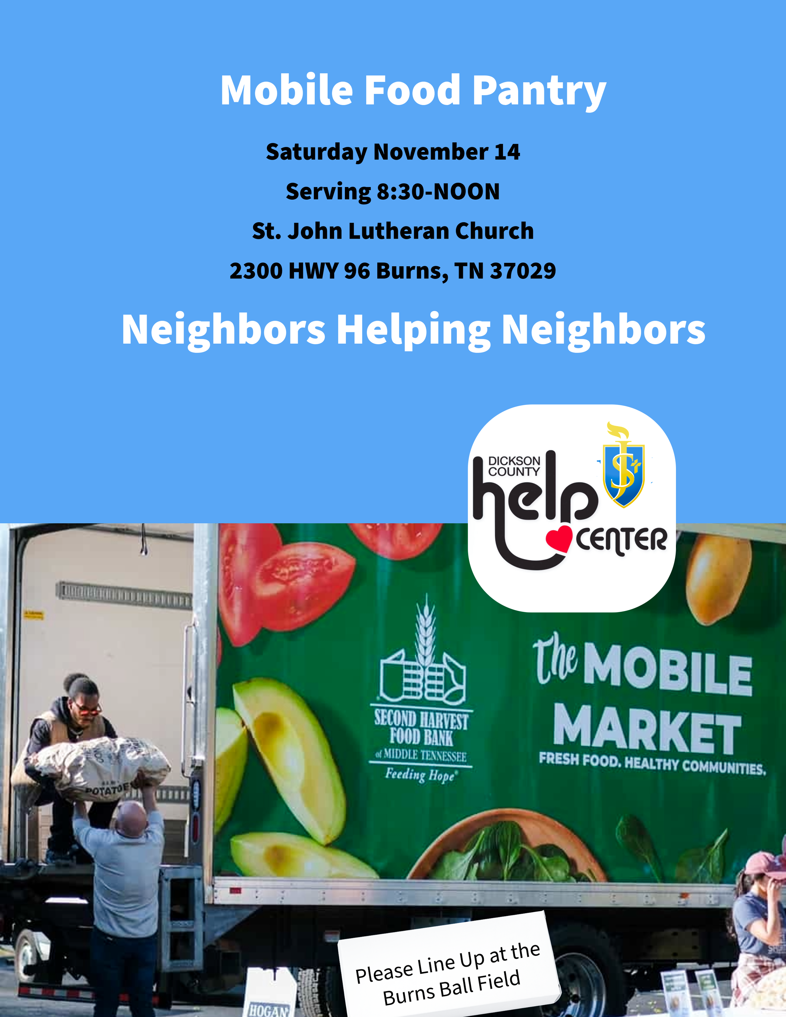 A large blue banner on a truck promoting a mobile food pantry event on November 14 at St. John Lutheran Church in Burns, Tennessee. The banner features images of fresh vegetables and promotes feeding hope and healthy communities. There are people around the truck, with one person wearing a vest and holding a paper.