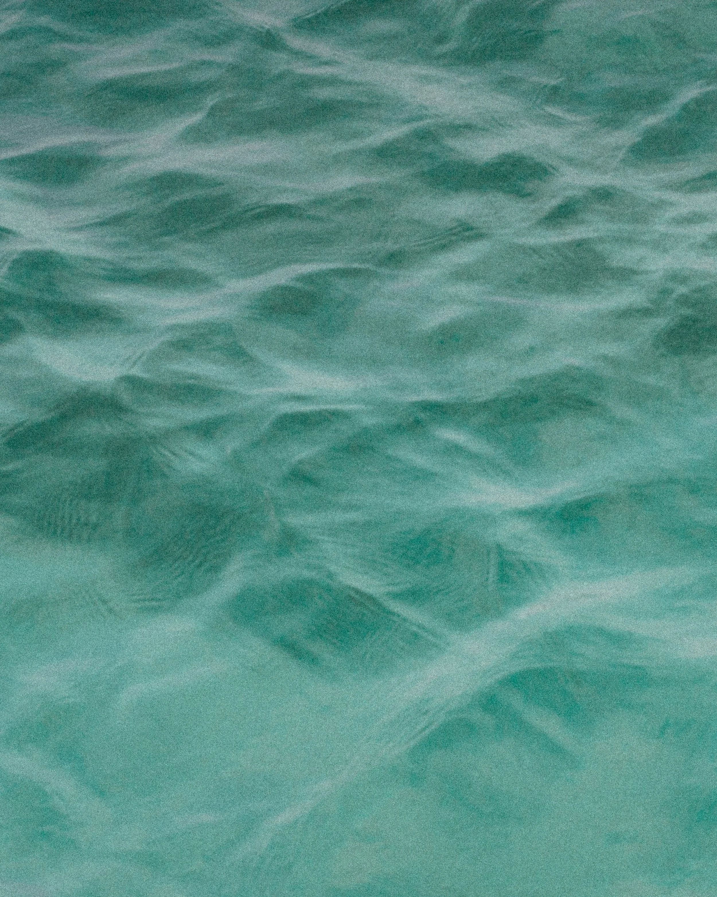 Close-up of turquoise ocean water with gentle waves
