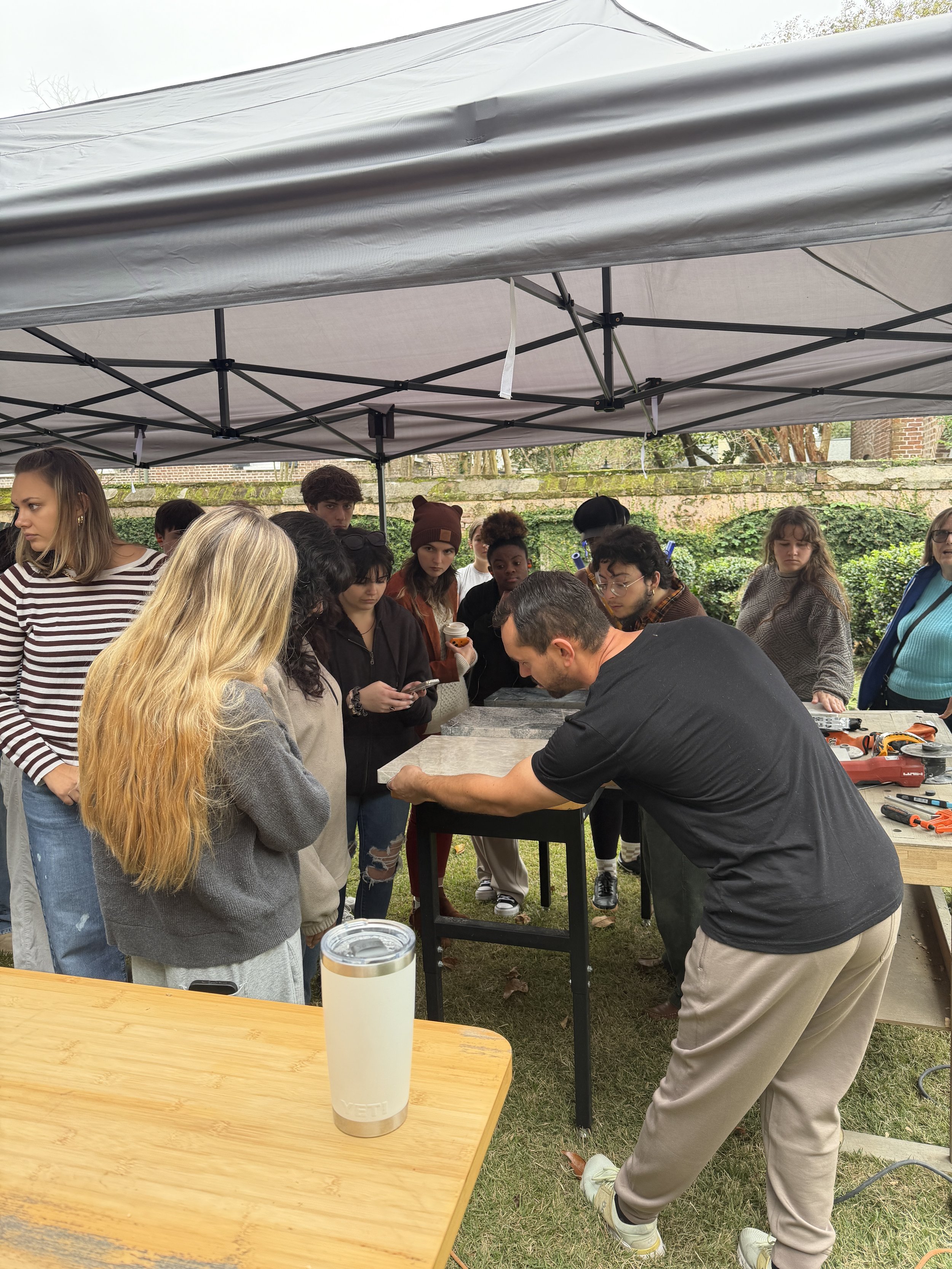 Ivan Andreev demonstrating professional stone tools at College of Charleston masterclass