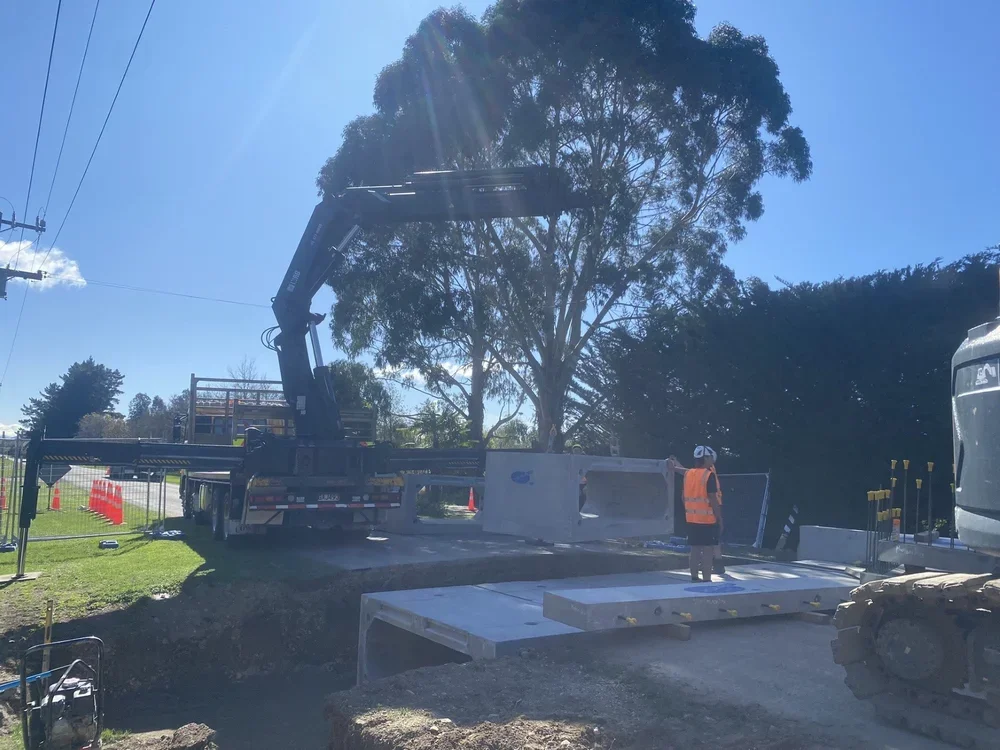 blue sky, trees, roading, underground, civil, drainage