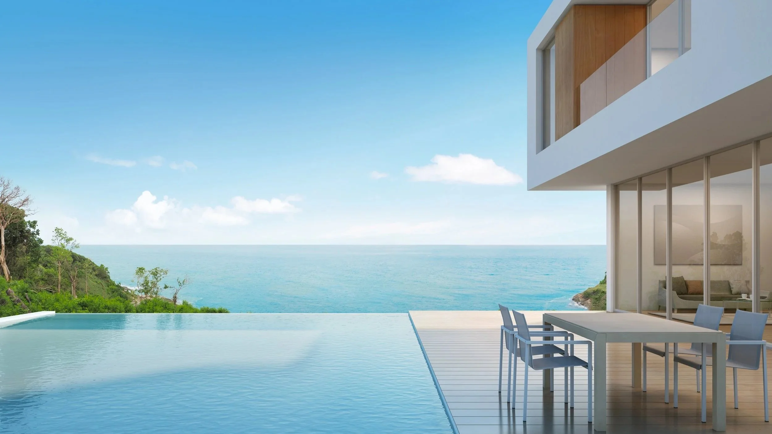 Your next purchase. Modern 'sea change' house with large glass windows overlooking a pool and ocean view, outdoor dining table with chairs on a wooden deck.